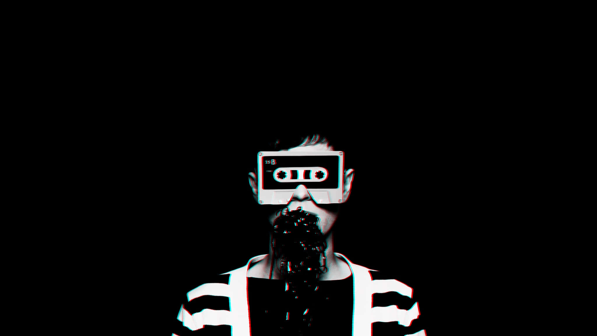 Hipster 桌布 壁紙 — 一個人用卡式錄音帶遮住雙眼，液體從口中滴落，背景為黑色。