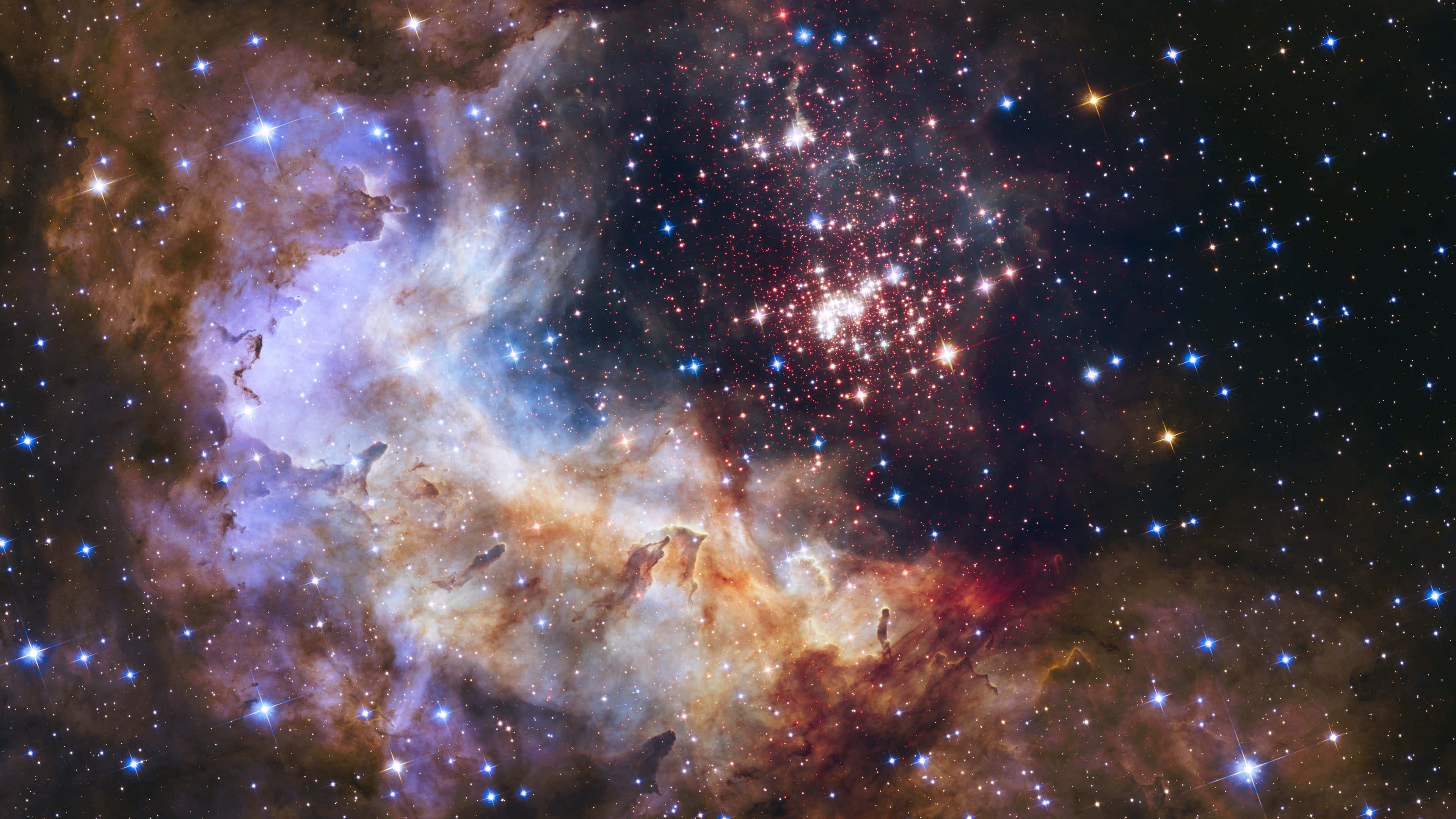 太空 桌布 壁紙 — 一個令人嘆為觀止的宇宙場景，展現了在藍色、紅色和橙色中發光的鮮豔星雲，周圍是密集閃爍的星群。