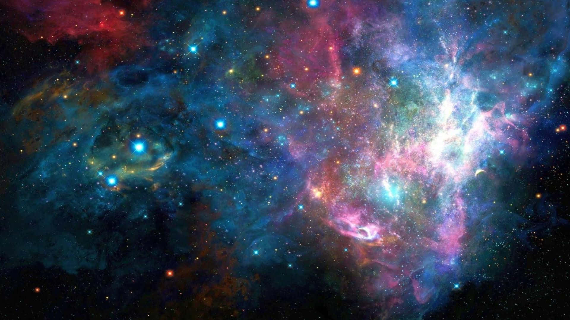 全高清 桌布 壁紙 — 一個令人嘆為觀止的宇宙星雲，在佈滿星星的黑色虛空中旋轉著鮮豔的藍色、粉紅色和橙色。