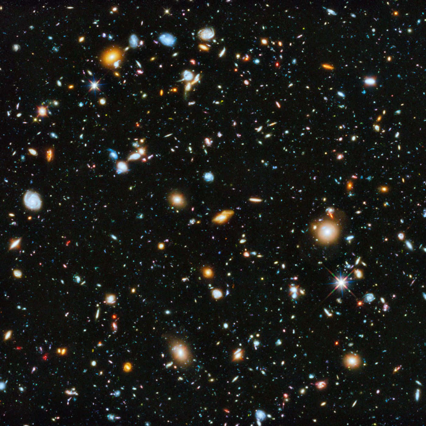 Outerspace 桌布 壁紙 — 一個令人嘆為觀止的宇宙景觀，充滿了無數星系和恆星，在深邃的黑色太空虛空中閃耀著鮮豔的色彩。