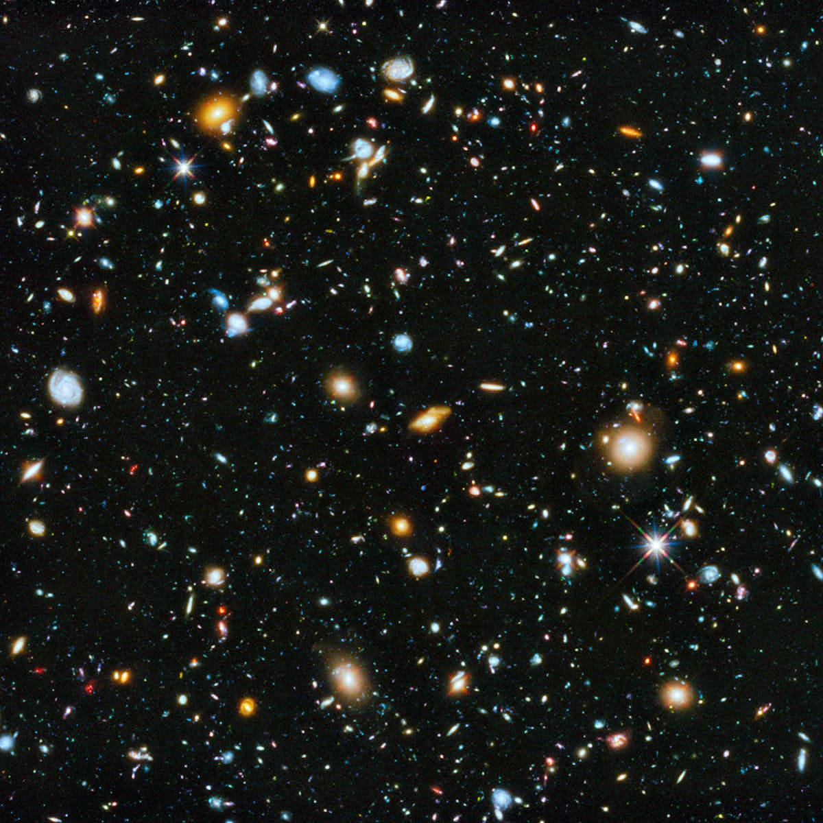 銀河 桌布 壁紙 — 一個令人嘆為觀止的宇宙景觀，充滿了無數星系和恆星，在深邃的黑色太空虛空中散發出鮮豔的色彩。