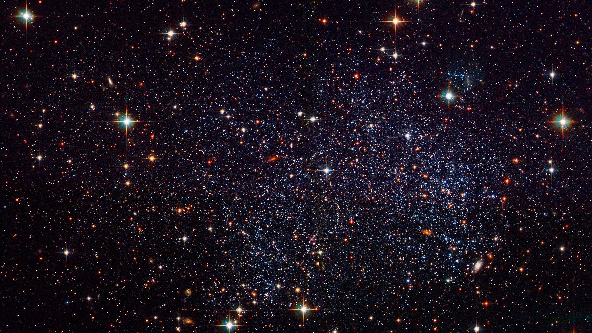 夜空 桌布 壁紙 — 一個令人嘆為觀止的密集星場景觀，無數閃爍的星星和宇宙塵埃襯托著深邃的黑色虛空。