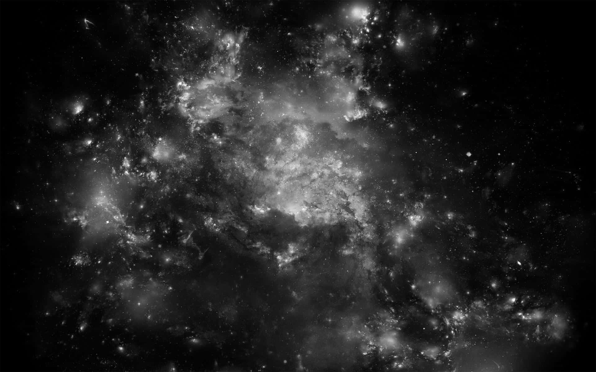 Black Space 桌布 壁紙 — 一個令人嘆為觀止的灰階視角，展現了密集的星場，其中有發光的星雲和散落的宇宙塵埃，背景是深邃的黑色虛空。