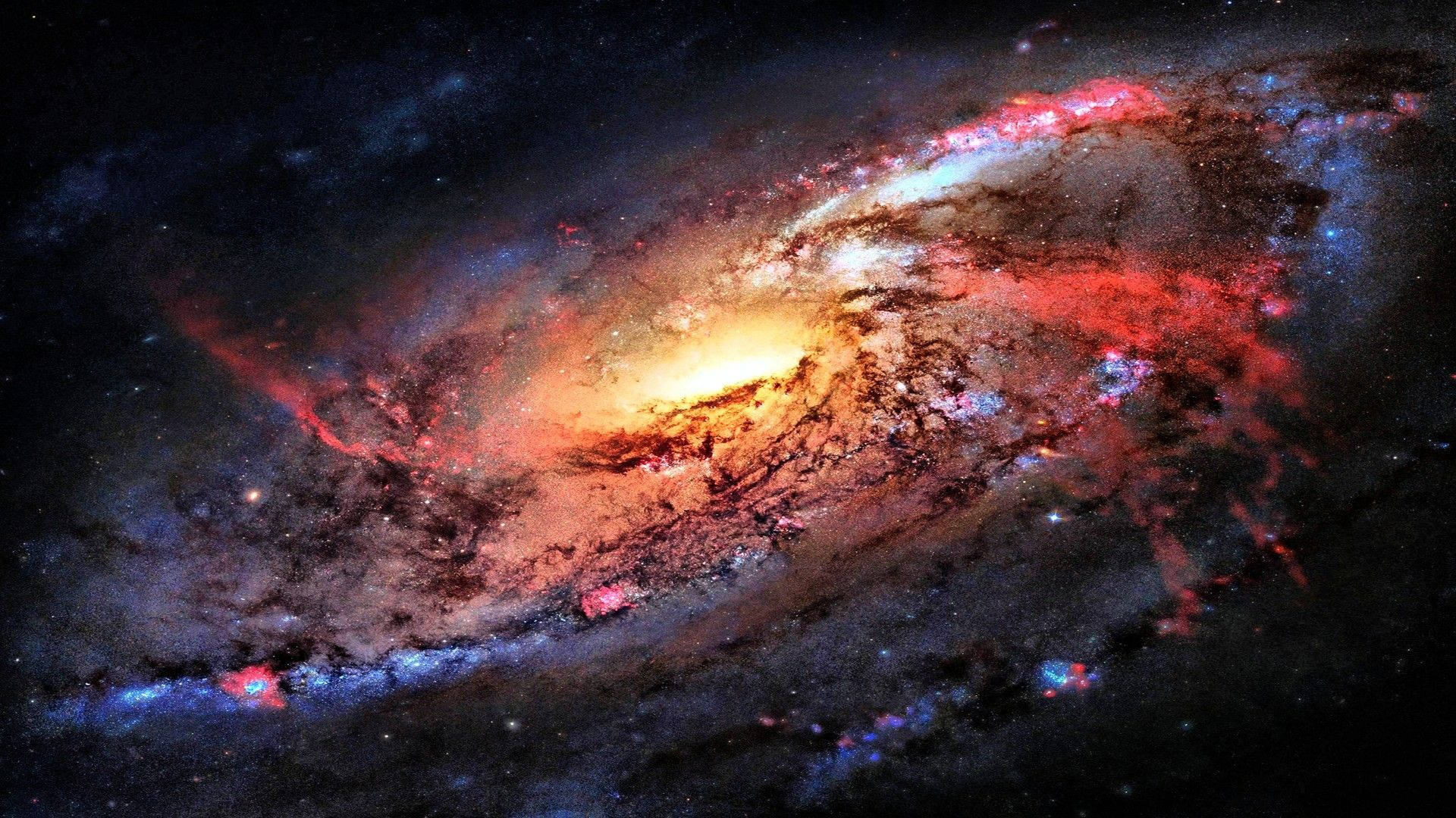 Stars 桌布 壁紙 — 一個令人嘆為觀止的螺旋星系，以火紅、金色和冷藍色在繁星點點的宇宙虛空中旋轉。