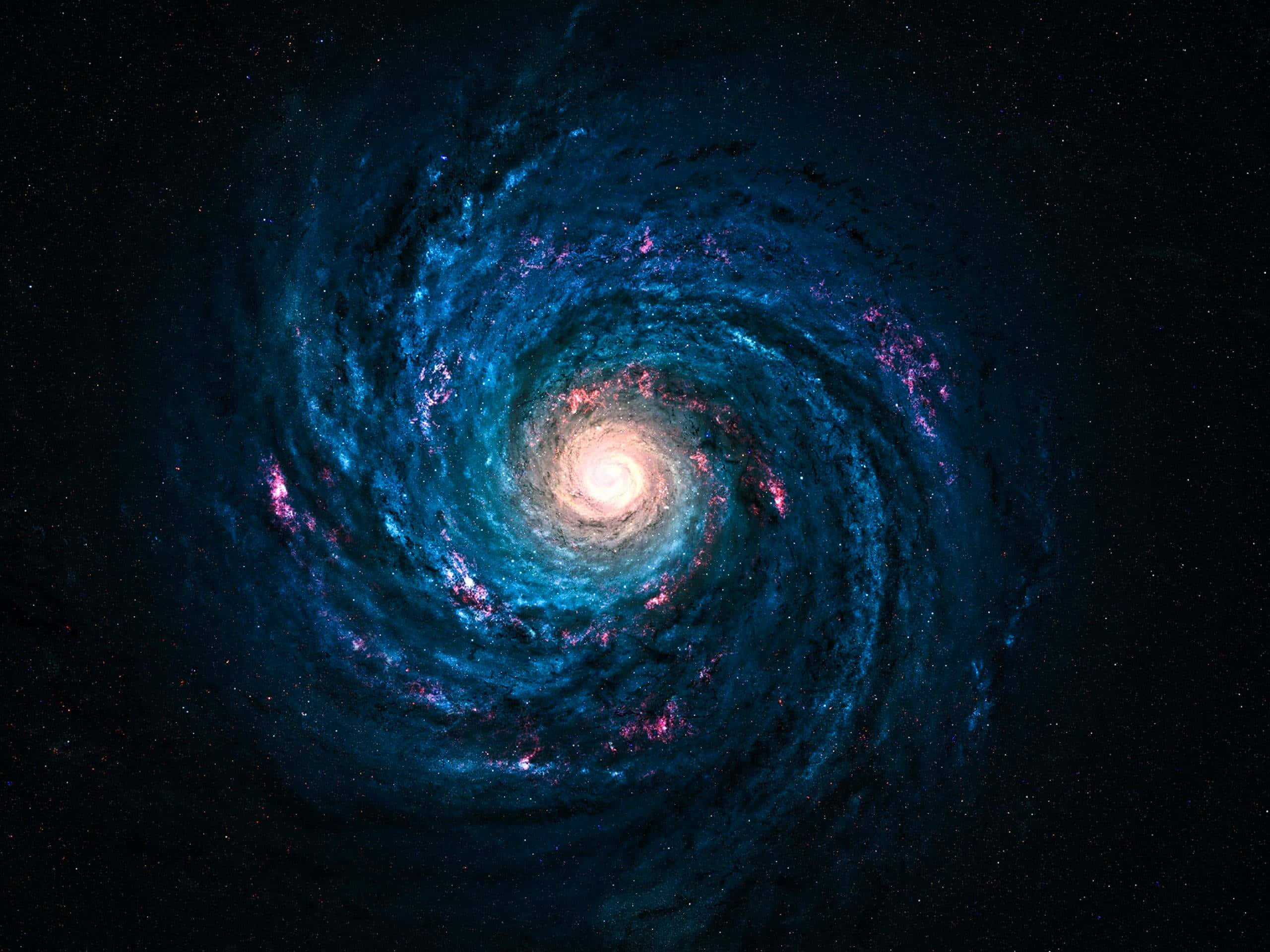 銀河 桌布 壁紙 — 一個令人嘆為觀止的螺旋星系，在佈滿星辰的宇宙虛空中旋轉著鮮豔的藍色和粉紅色星雲。