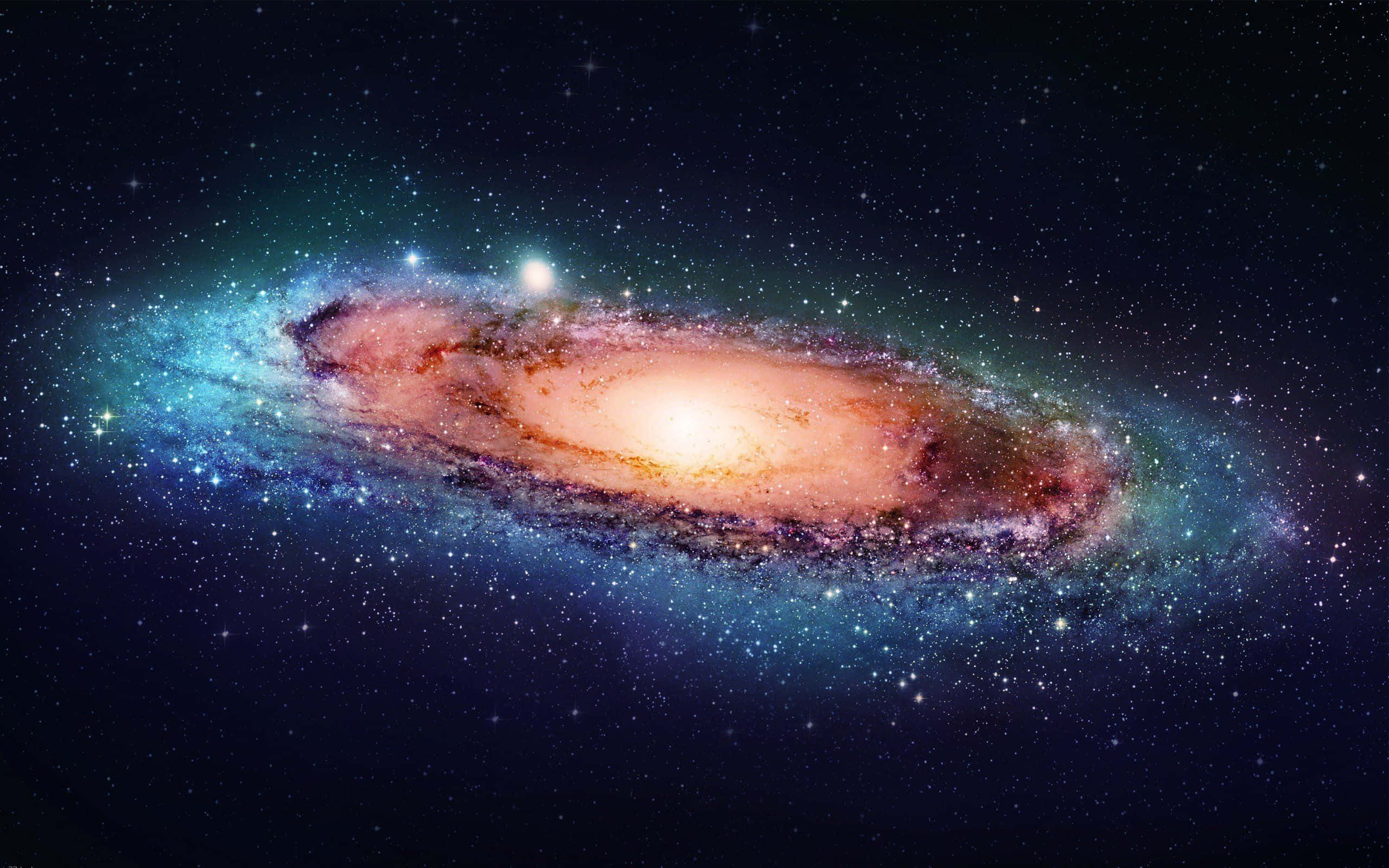 Whirlpool Galaxy 桌布 壁紙 — 一個令人嘆為觀止的螺旋星系，在星空中閃耀著橙色和藍色調。