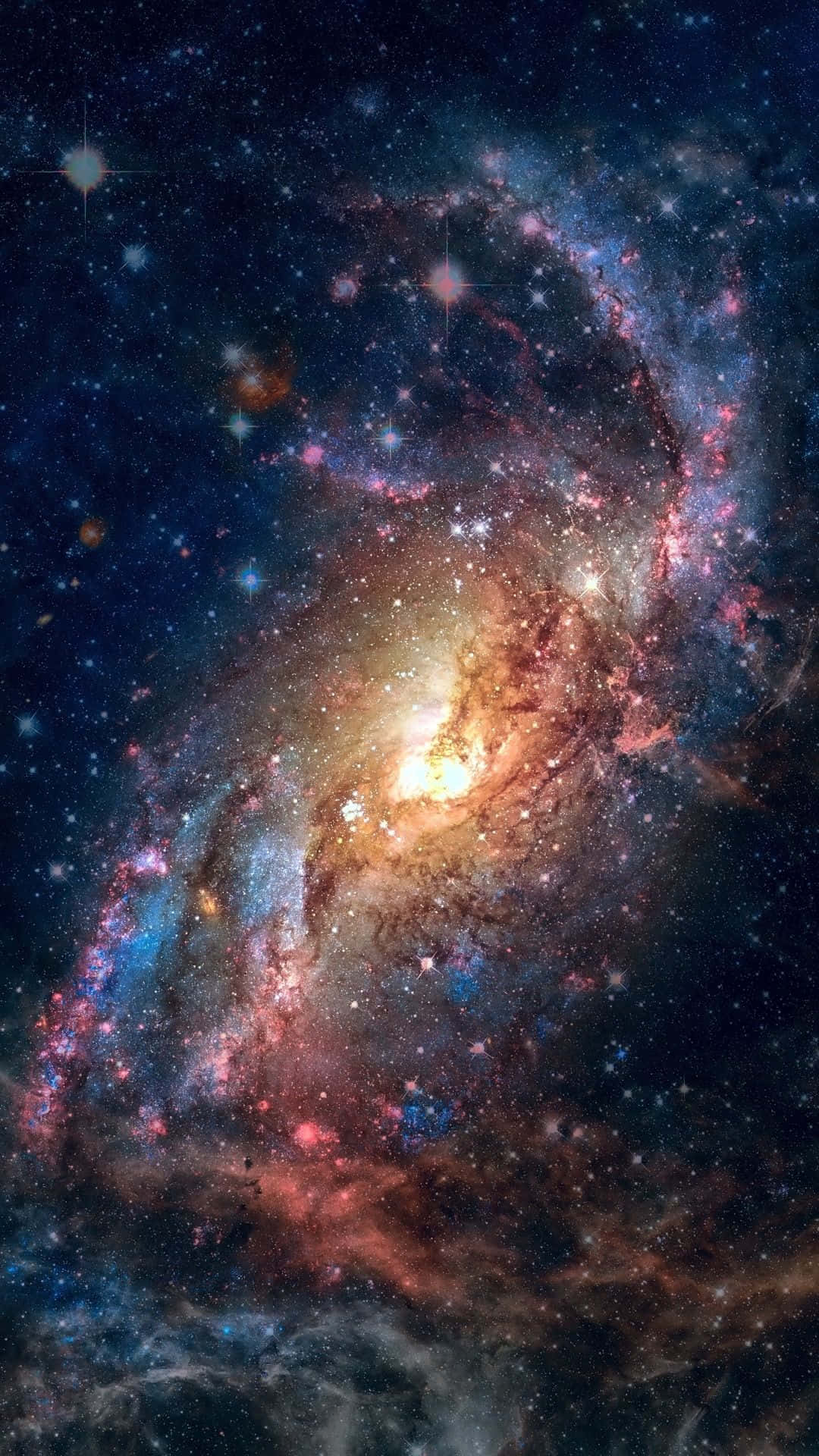 Stars 桌布 壁紙 — 一個令人嘆為觀止的螺旋星系，在星空中旋轉著充滿活力的粉紅色、藍色和金色星雲。