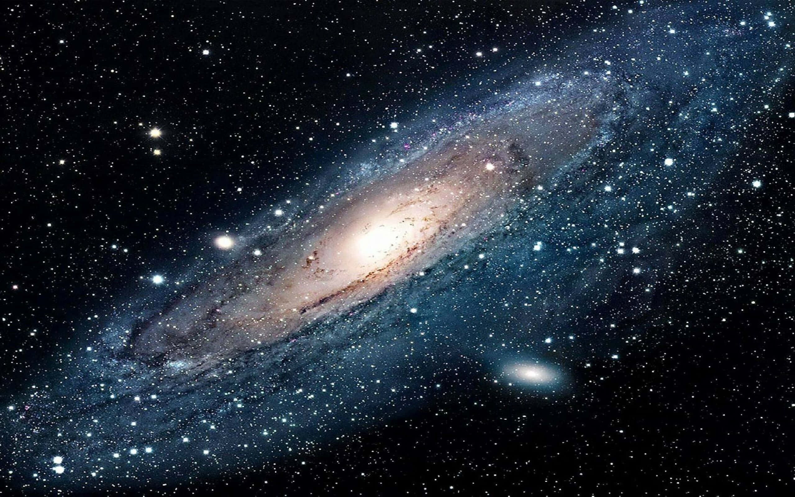 太空 桌布 壁紙 — 一個令人嘆為觀止的螺旋星系，在深邃的黑色宇宙背景下閃爍著數十億顆恆星。
