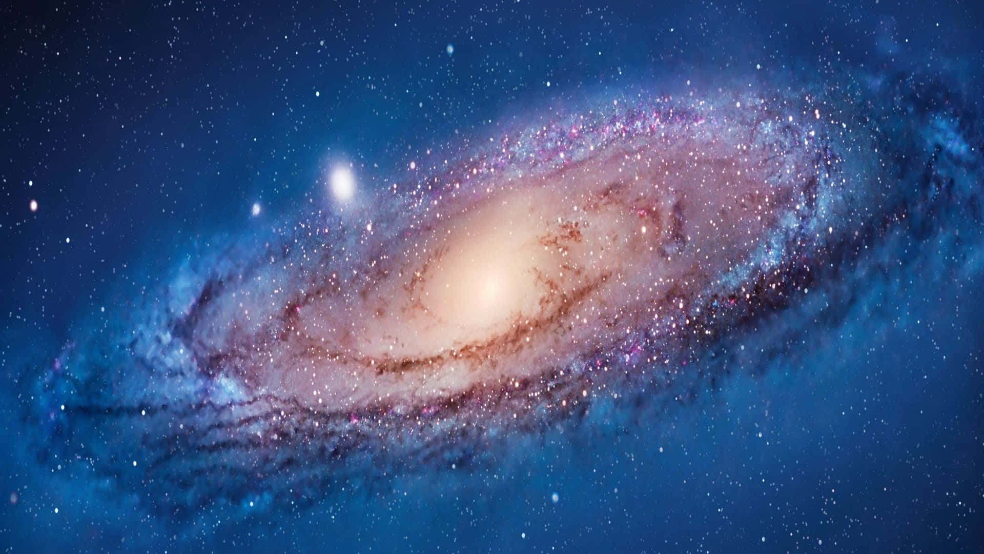 桌布 壁紙 — 一個令人嘆為觀止的螺旋星系，在深藍色天鵝絨般的天空中旋轉，閃爍著星星和宇宙塵埃。