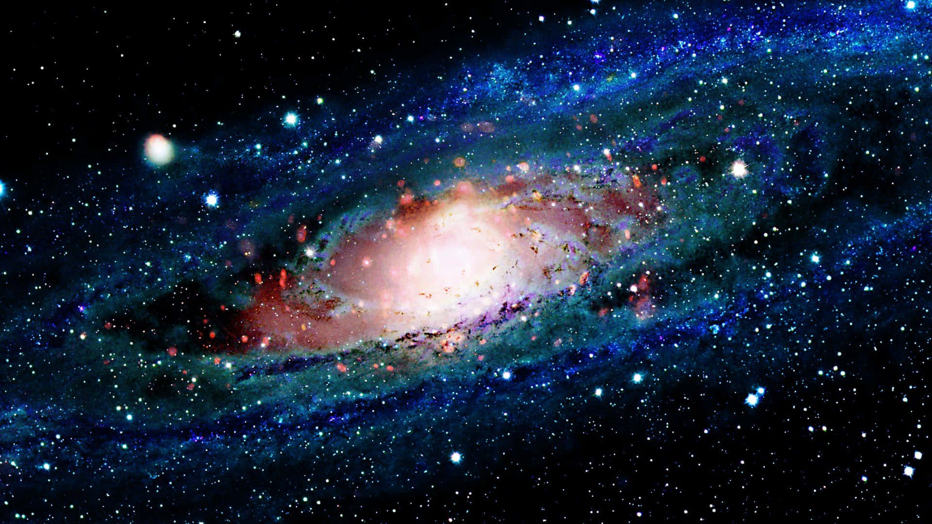 酷炫太空 桌布 壁紙 — 一個令人嘆為觀止的螺旋星系，在繁星點點的宇宙背景下散發出粉紅色和藍色的光芒。