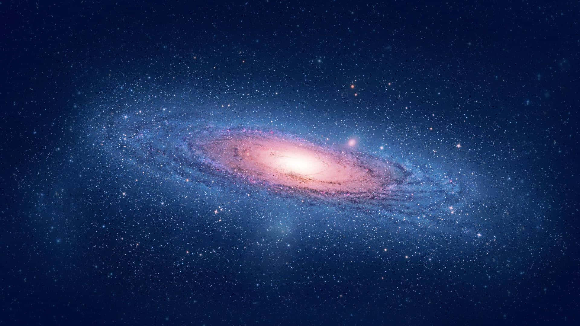 銀河 桌布 壁紙 — 一個令人嘆為觀止的螺旋星系，在繁星點點的宇宙背景下散發出粉紅色和藍色的光芒。