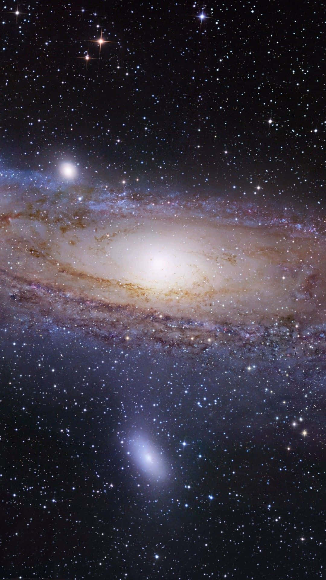 銀河 桌布 壁紙 — 一個令人嘆為觀止的螺旋星系，擁有發光的旋臂和無數恆星，背景是深邃的宇宙黑色。