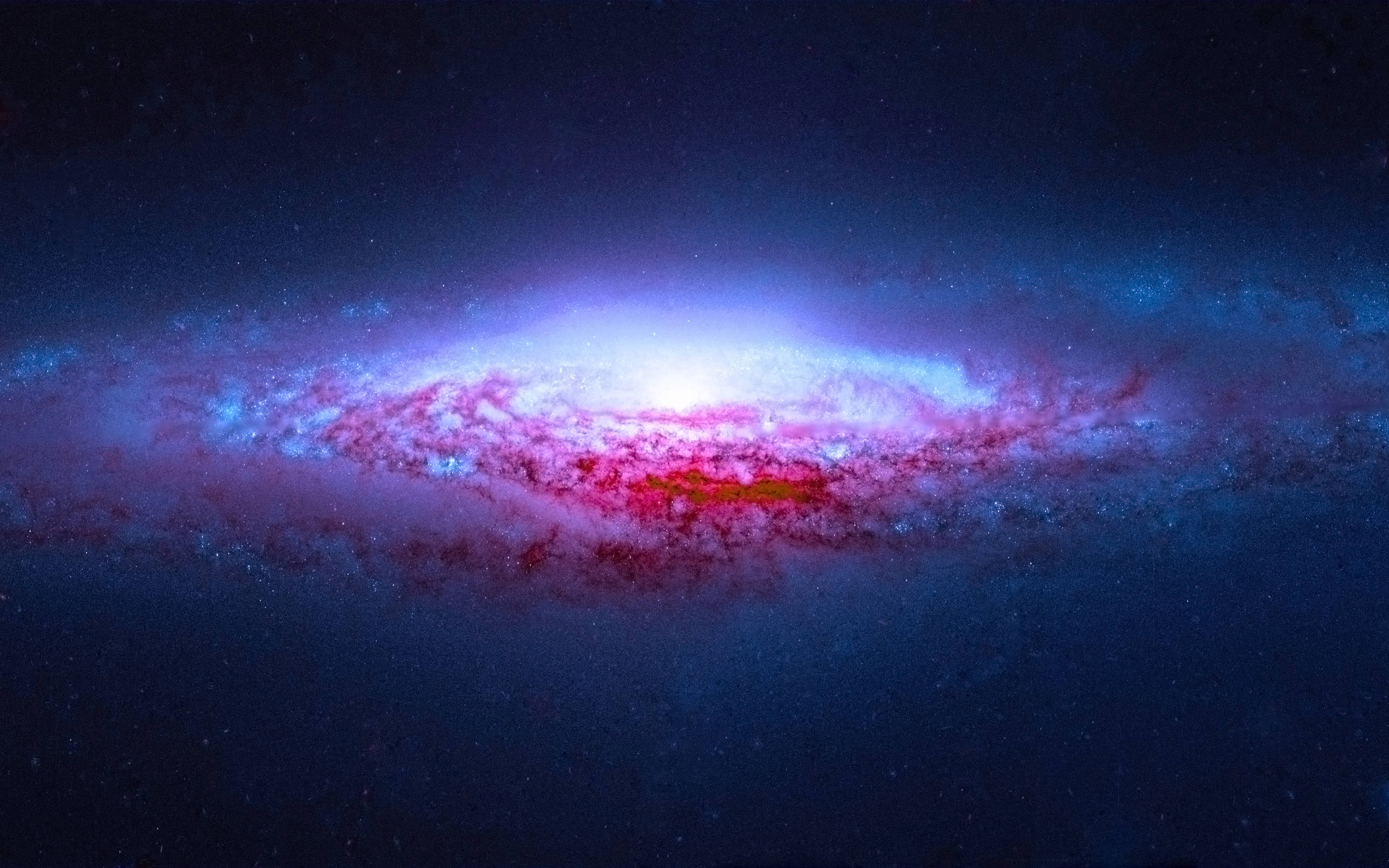 宇宙美學 桌布 壁紙 — 一個令人嘆為觀止的螺旋星系在繁星點點的宇宙背景下散發出充滿活力的藍色和粉紅色調。