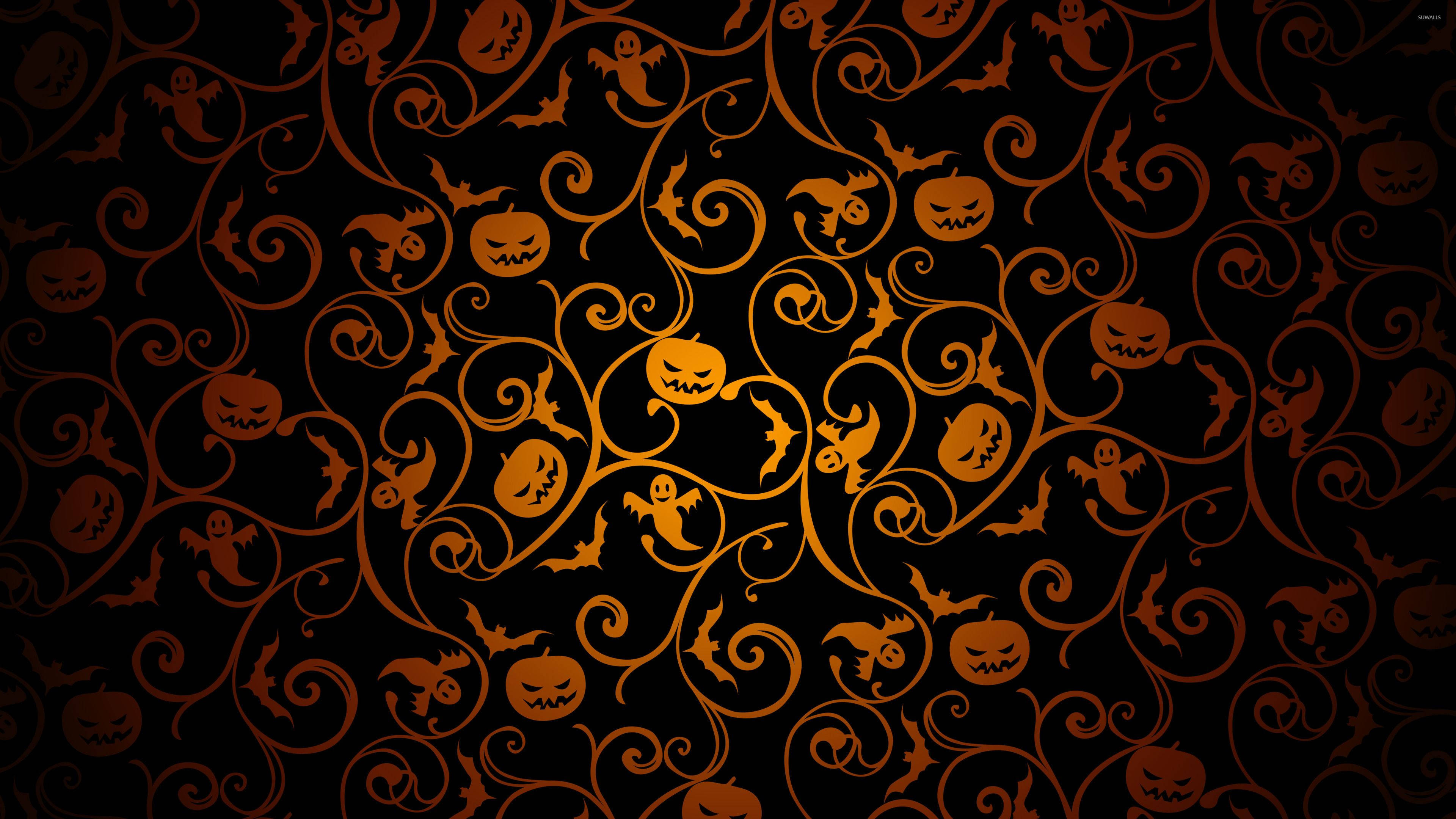 Dark Halloween 桌布 壁紙 — 一個令人毛骨悚然的萬聖節桌布，黑色背景上裝飾著旋轉的橙色藤蔓，點綴著南瓜燈、鬼魂和蝙蝠。