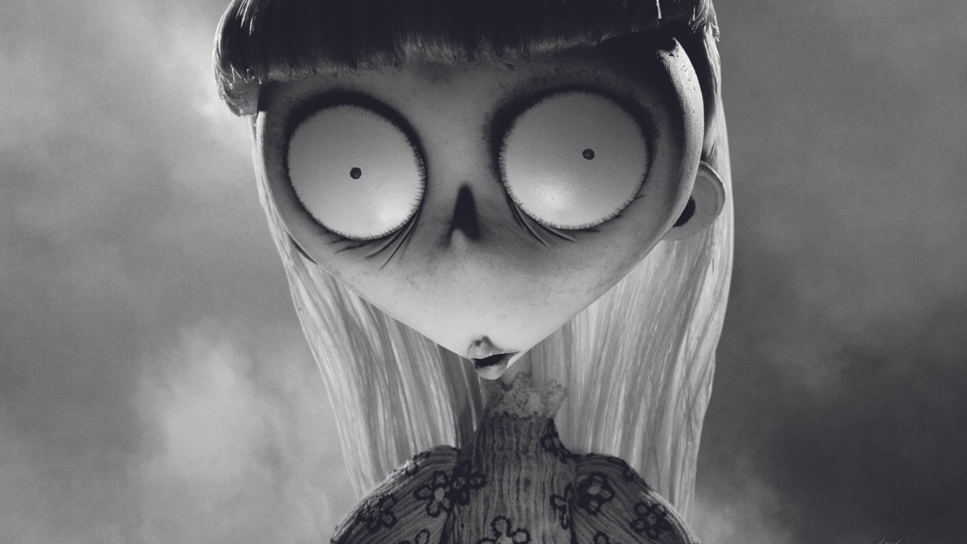 Frankenweenie 桌布 壁紙 — 一個令人難忘的黑白特寫，一個蒼白的動畫女孩，有著巨大的睜大眼睛和小小的嘴巴，直視前方。