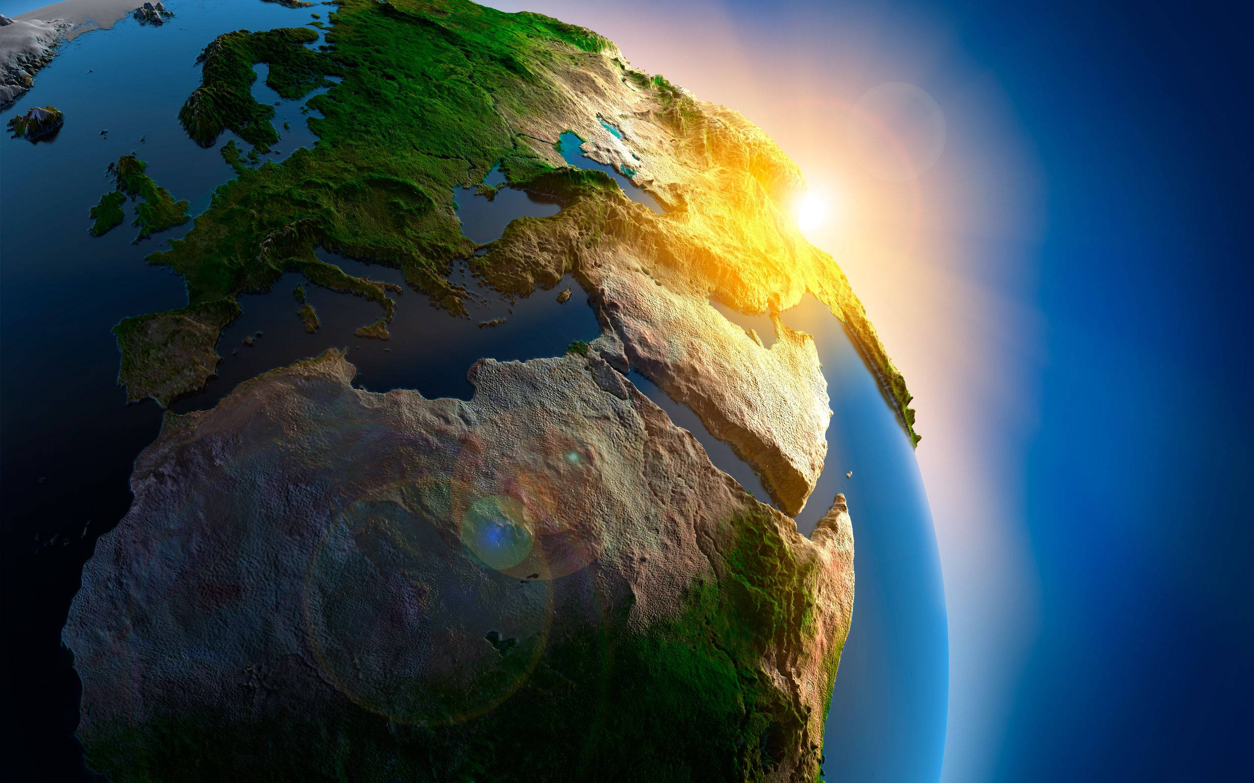 地球 桌布 壁紙 — 一個令人驚嘆的地球3D渲染，太陽從歐洲和非洲升起，將金色光芒灑向各大洲和海洋。