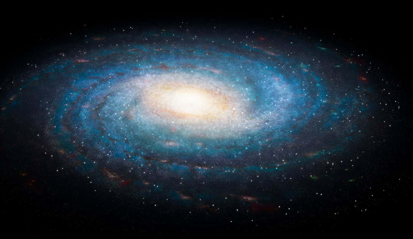 Galactic Center 桌布 壁紙 — 一個令人驚嘆的螺旋星系，在佈滿星辰的宇宙虛空中閃耀著藍色和金色的色調。