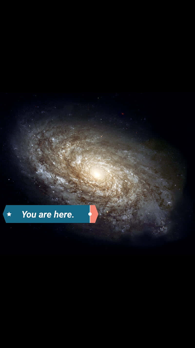桌布 壁紙 — 一個令人驚嘆的螺旋星系，帶有發光的旋臂和明亮的核心，主宰著黑暗的宇宙虛空。