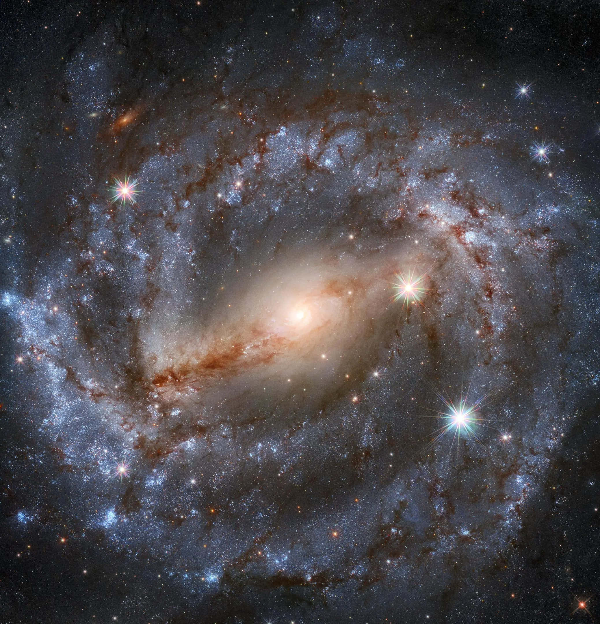 Nasa Galaxy 桌布 壁紙 — 一個令人驚嘆的螺旋星系，帶有發光的旋臂和明亮的恆星在宇宙黑暗中旋轉。