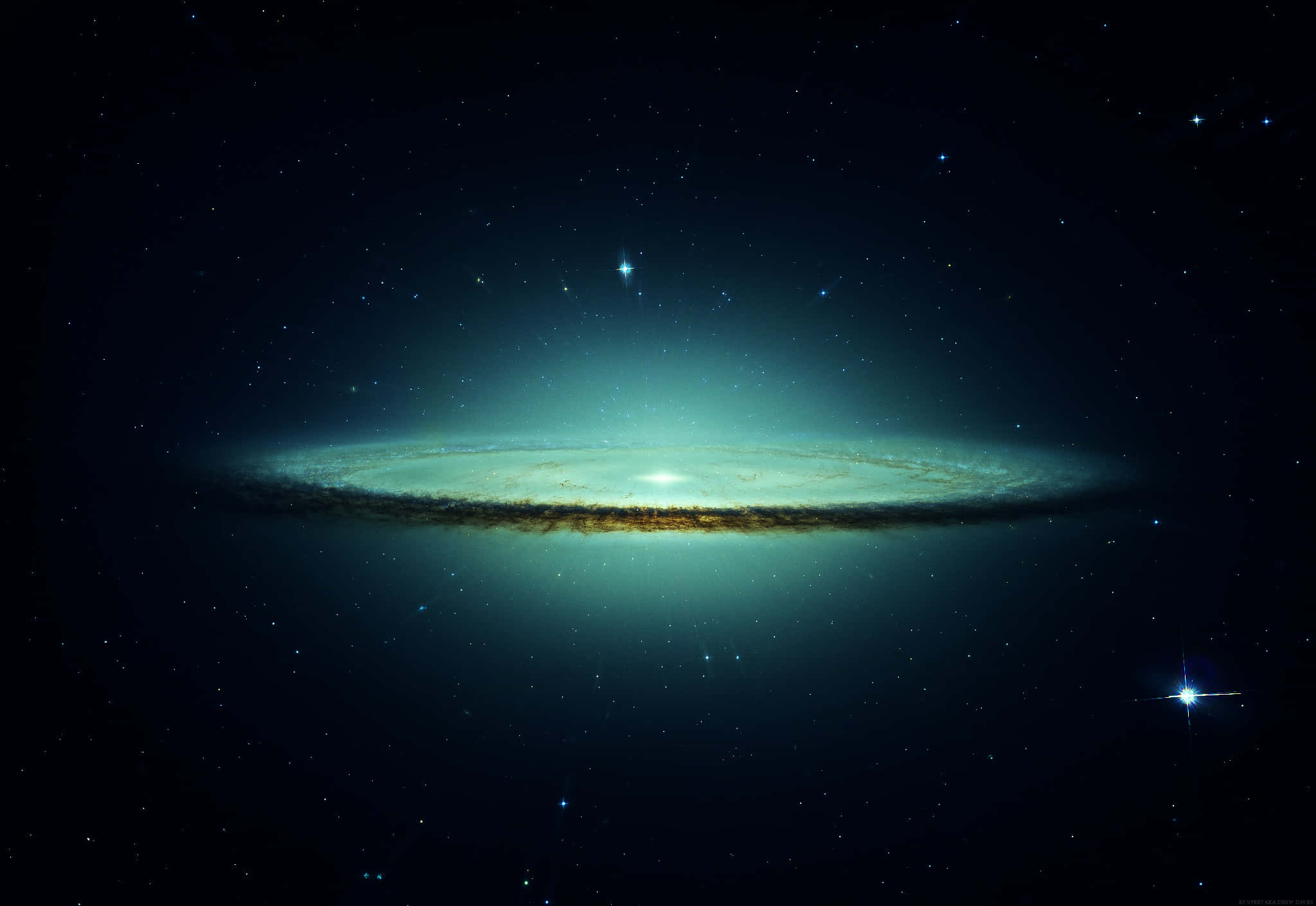 Space Desktop 桌布 壁紙 — 一個令人驚嘆的螺旋星系在宇宙黑暗中閃耀著青綠色和金色的色調，背景是星場。