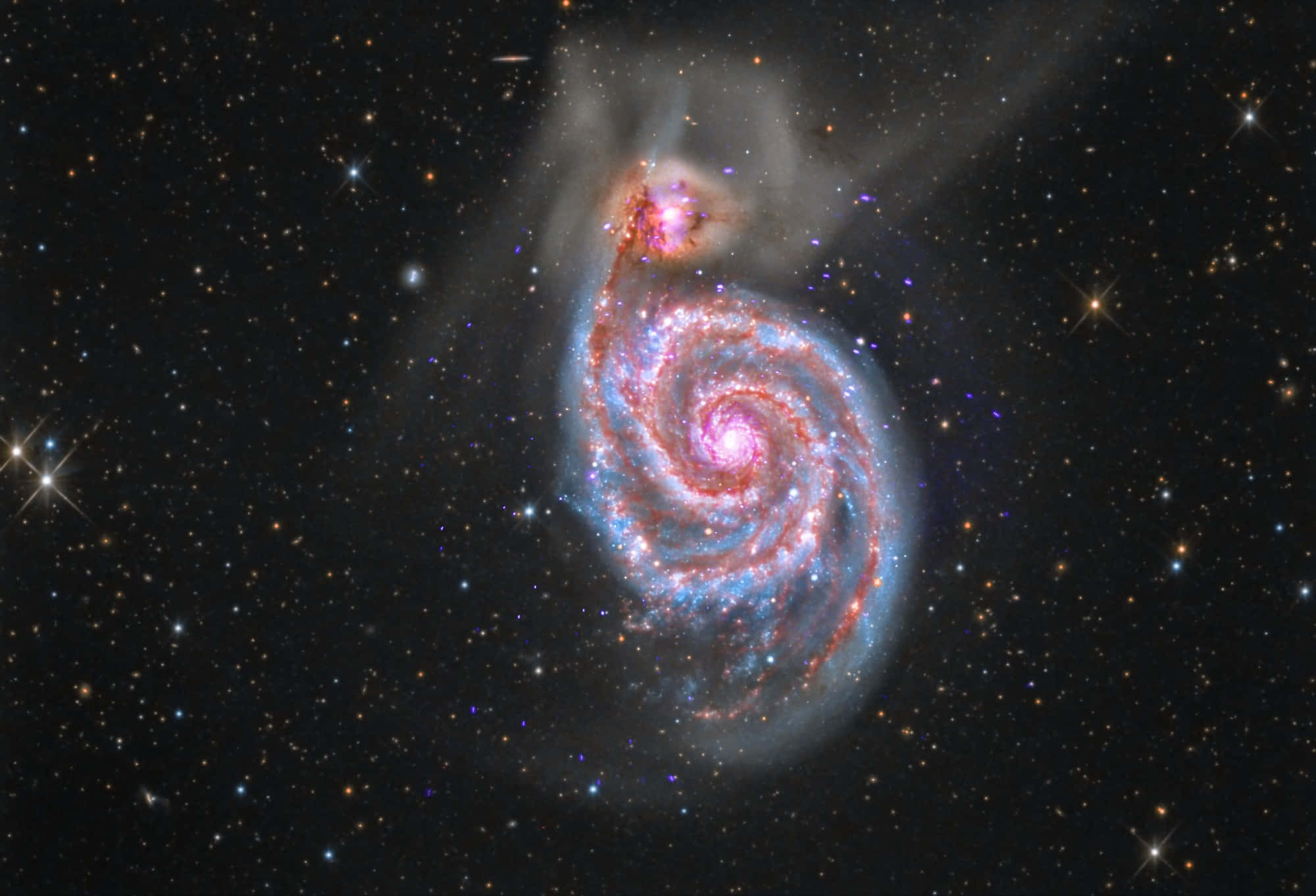 Nasa Galaxy 桌布 壁紙 — 一個令人驚嘆的螺旋星系在星空背景下旋轉，呈現粉紅色和藍色色調。