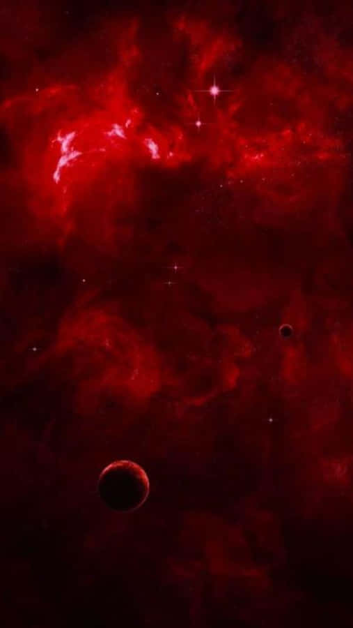 紅色 iPhone 桌布 壁紙 — 一個以深紅色星雲為主導的宇宙場景，閃爍的星星和兩顆黑暗行星在虛空中漂流。