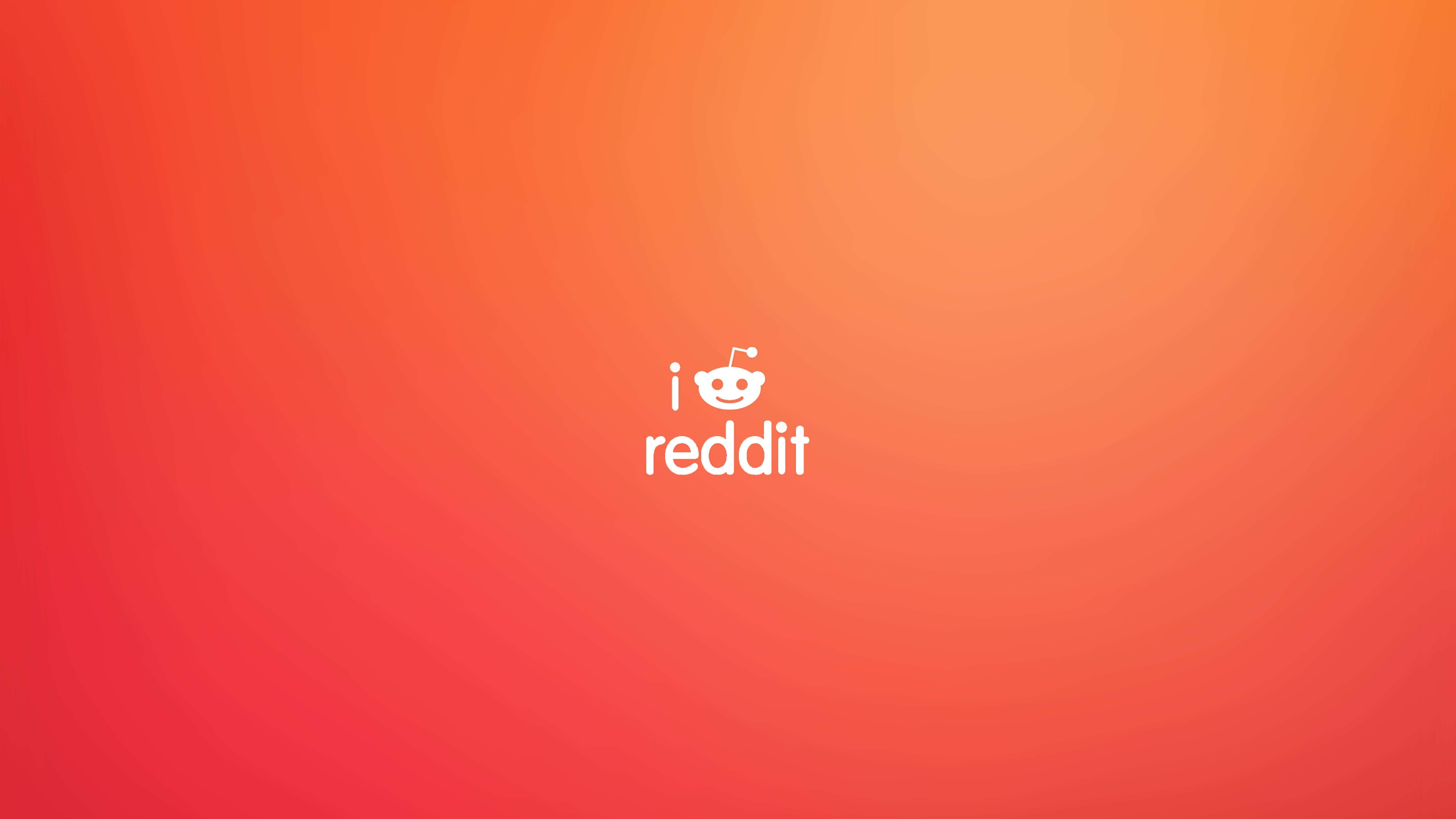 Reddit 桌布 壁紙 — 一個以溫暖紅色和橙色為主的極簡漸變背景，中央放置白色Reddit標誌。