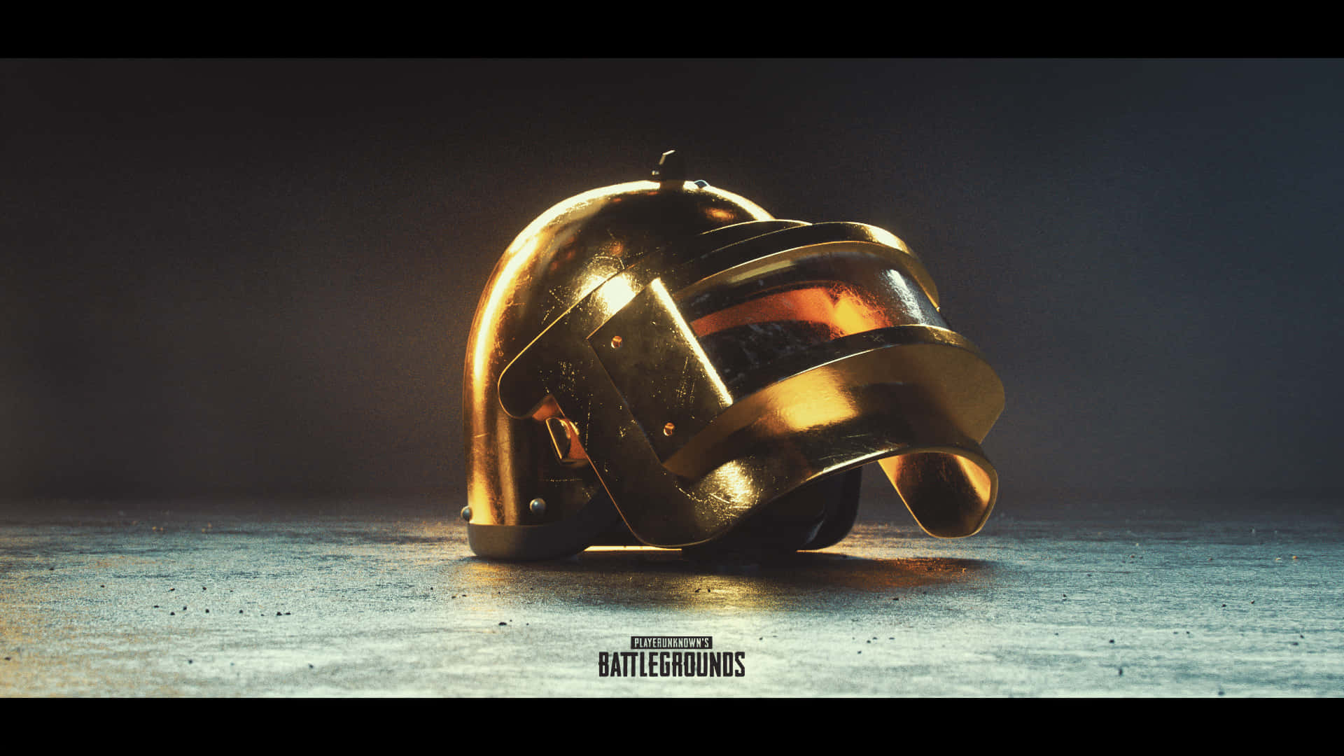 電玩遊戲 桌布 壁紙 — 一個來自PUBG Battlegrounds的金色頭盔放在粗糙的地板上，光線效果戲劇化。