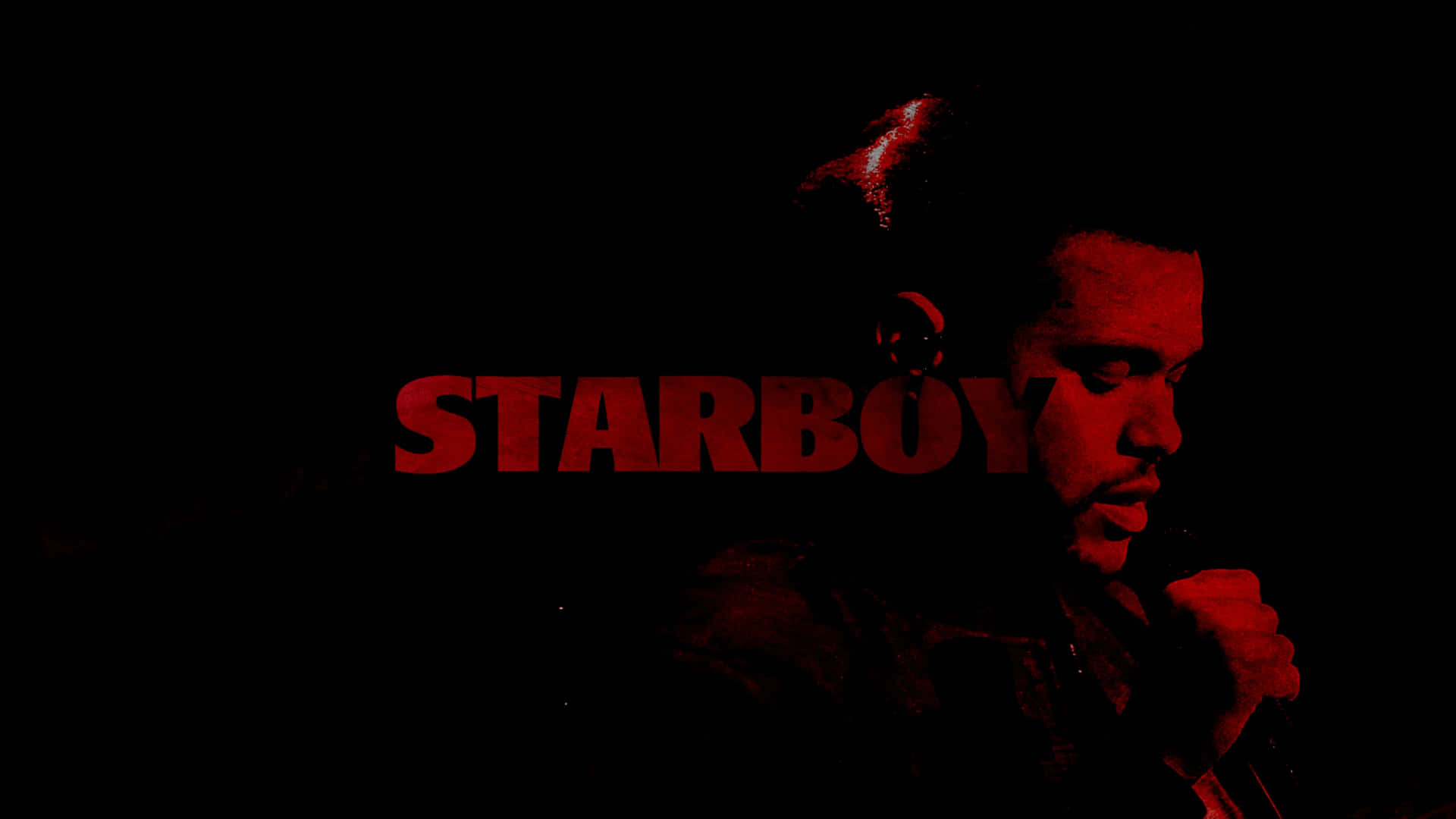 男人剪影在紅光下拿著麥克風，帶有'STARBOY'文字。 — 威肯 GIF 壁紙