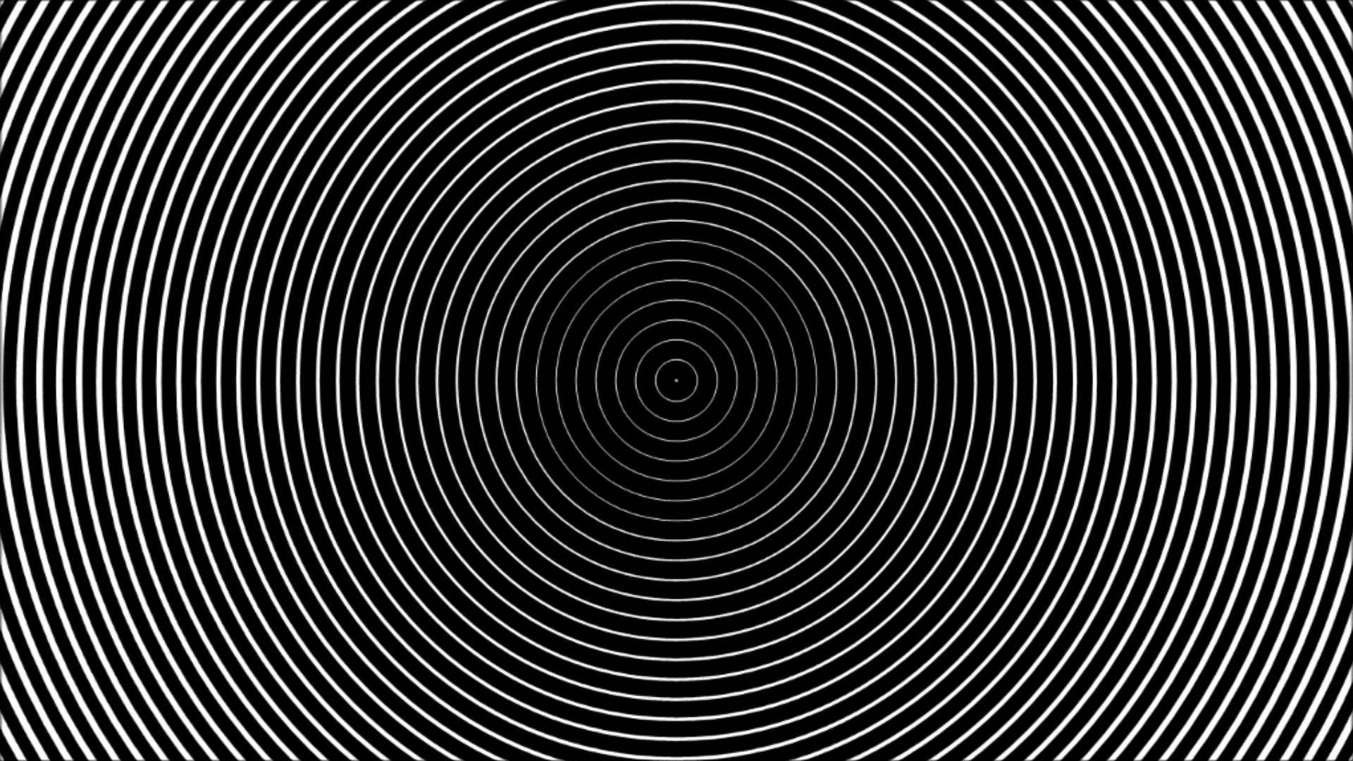 Hypnosis 桌布 壁紙 — 一個催眠般的圖案，由黑色背景上從中心點放射出的同心白色圓圈組成。