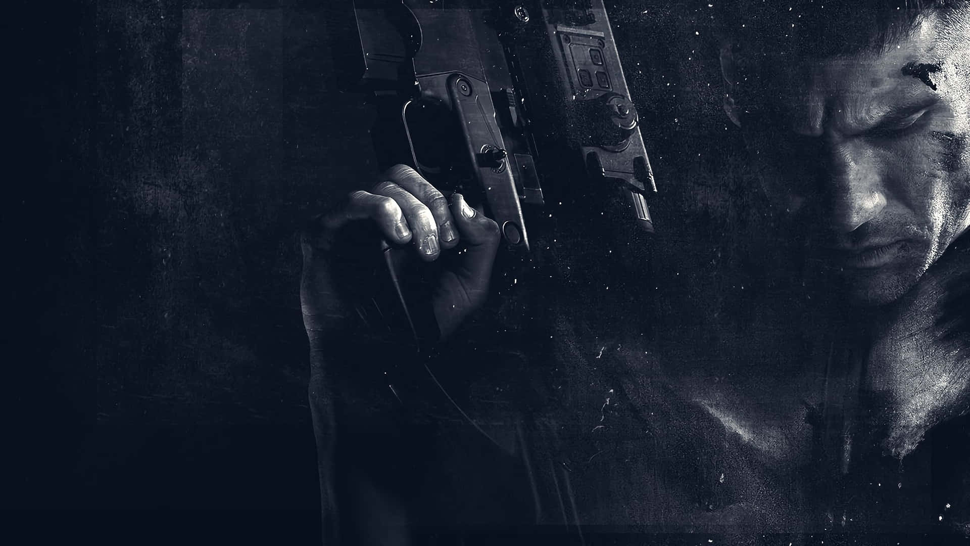 Punisher Desktop 桌布 壁紙 — 一個傷痕累累的男人在黑暗、有紋理的環境中緊握一把手槍的粗糙特寫。