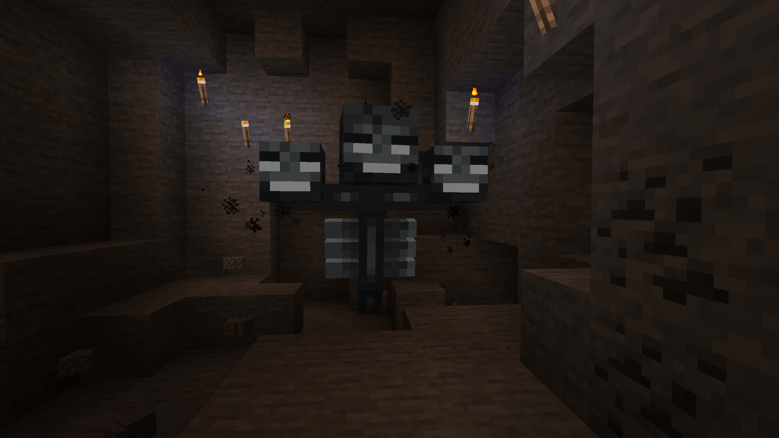 Minecraft Wither Boss 桌布 壁紙 — 一個像素化的 Minecraft 殭屍站在昏暗的石頭地牢中，火炬在磚牆上投射出搖曳的光芒。