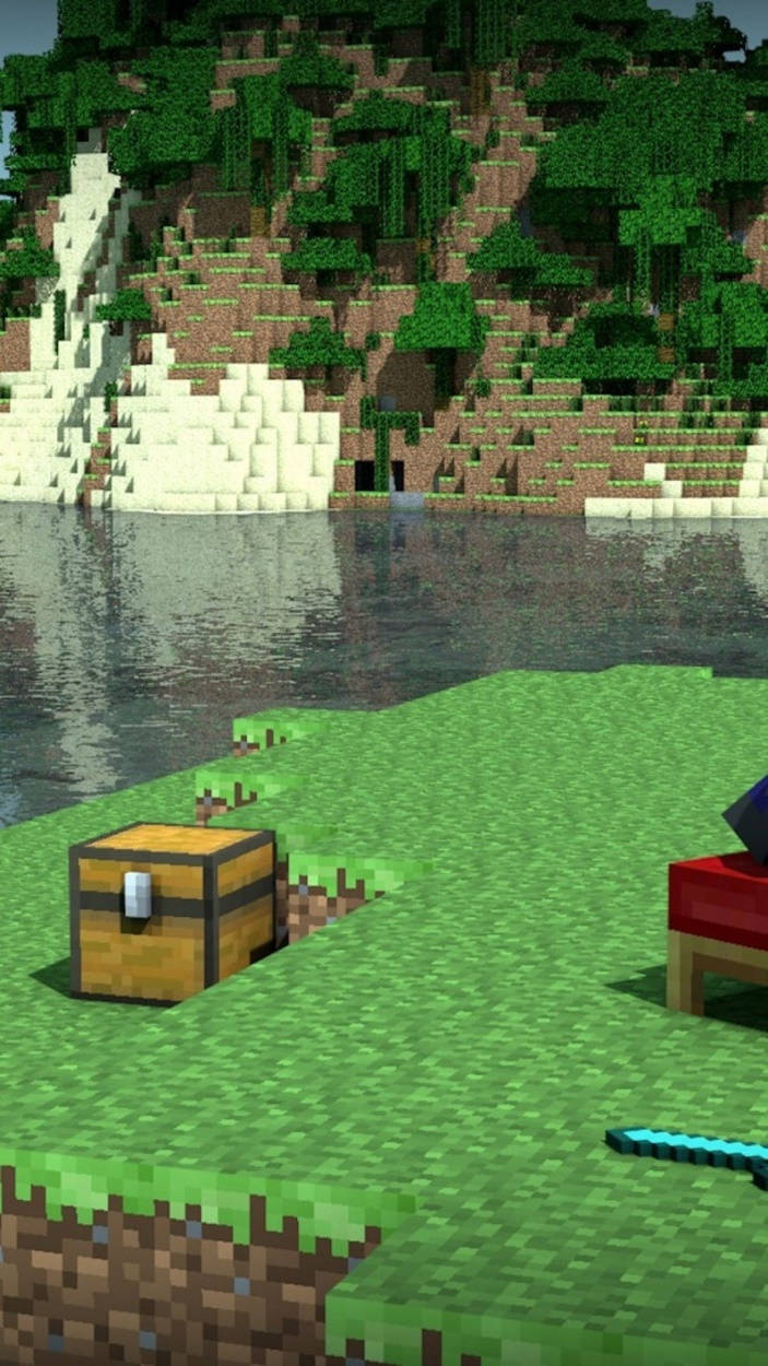 我的世界 鑽石 桌布 壁紙 — 一個像素化的Minecraft景觀，草地上有一個木箱，靠近水邊，背景是樹木繁茂的山丘。