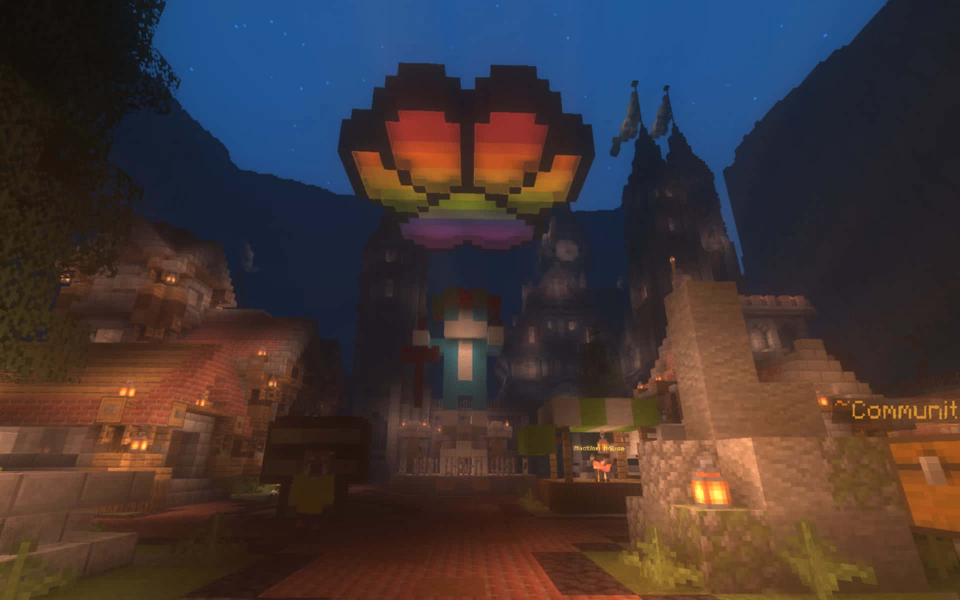 Minecraft Server 桌布 壁紙 — 一個像素化的Minecraft村莊在夜晚，發光的彩虹心形漂浮在石頭建築上方。