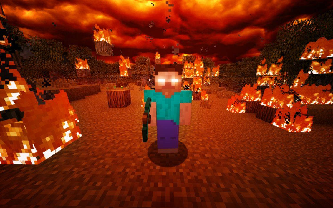 Herobrine 桌布 壁紙 — 一個像素化的Minecraft角色站在一片火紅的森林中，天空呈現血橙色，周圍的樹木劇烈燃燒。