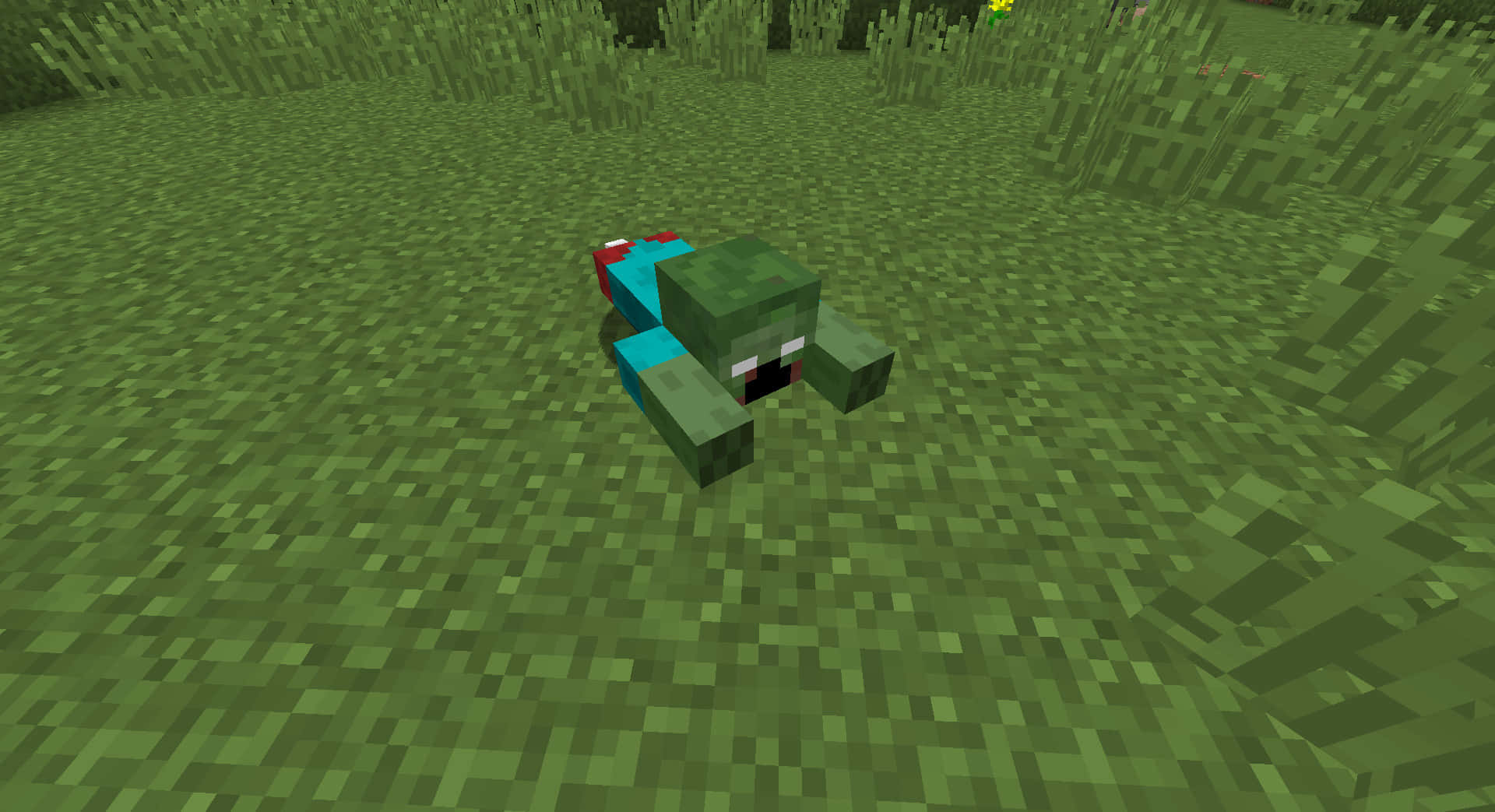 Minecraft Zombie 桌布 壁紙 — 一個像素化的殭屍趴在一個方塊Minecraft世界的草地上，在日光之下。
