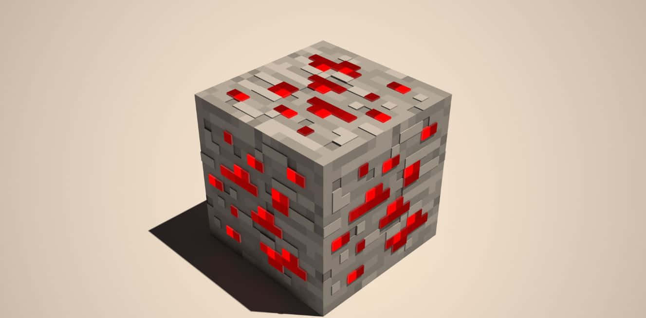 Minecraft Redstone 桌布 壁紙 — 一個像素化的灰色立方體，表面嵌有發光的紅色方塊，在純色背景上投下清晰的陰影。