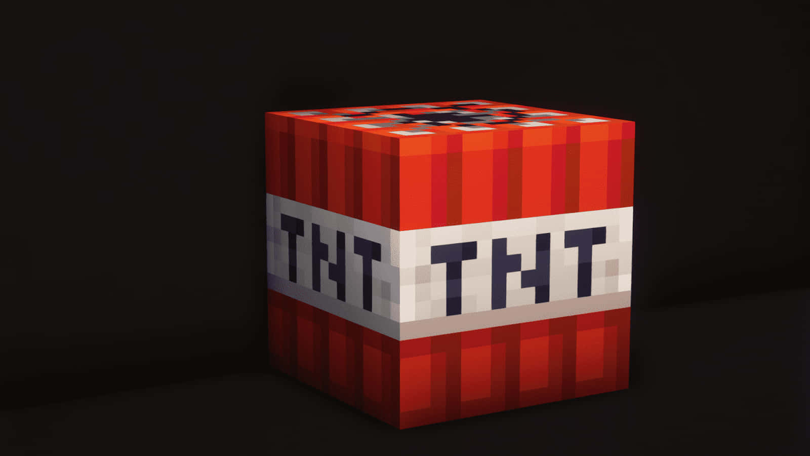 我的世界 TNT 桌布 壁紙 — 一個像素化的紅色TNT方塊，帶有白色標籤和黑色文字，孤立地立在深色背景上。