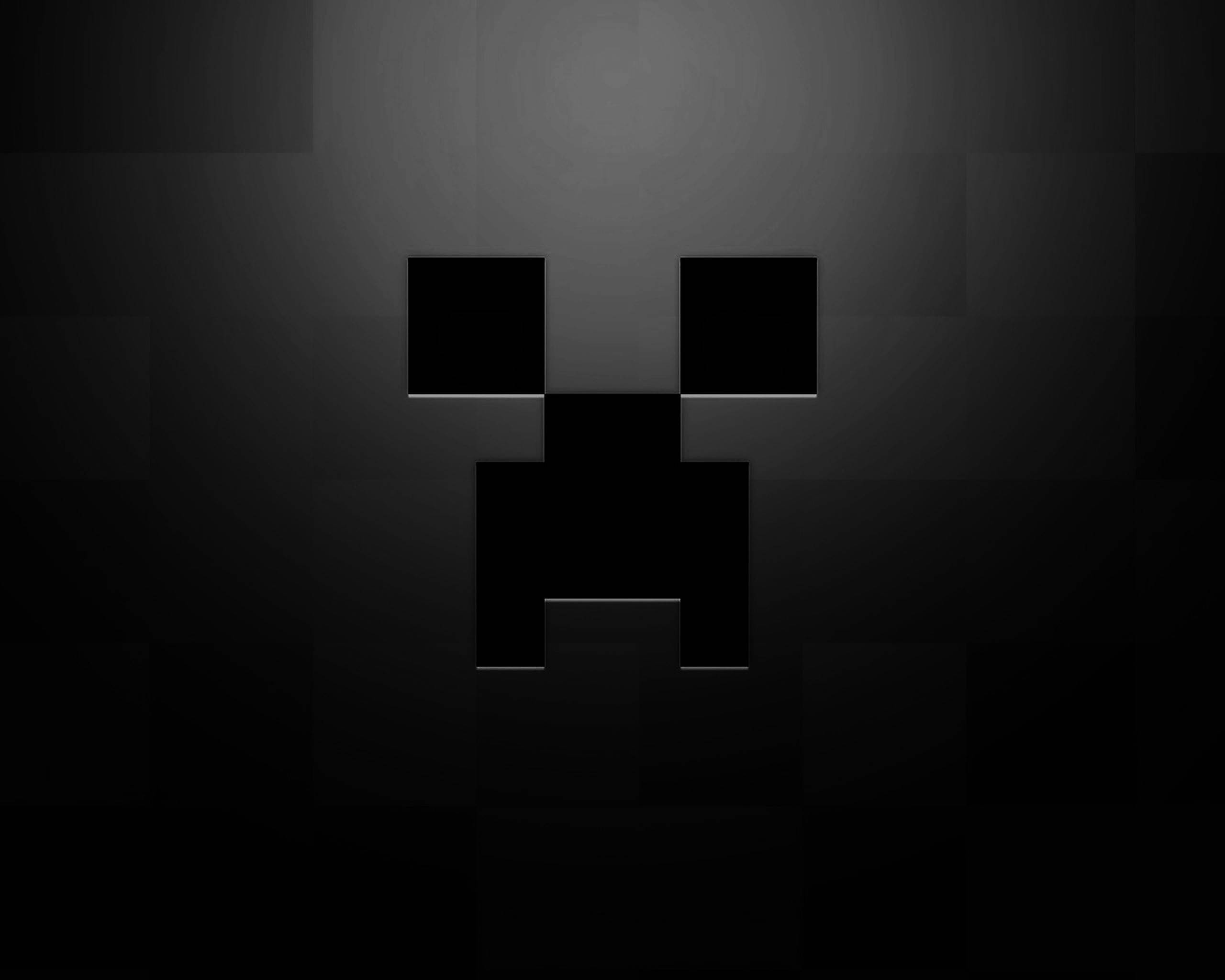 Creeper 桌布 壁紙 — 一個像素化的黑色苦力怕臉在深色漸變背景上微微發光。