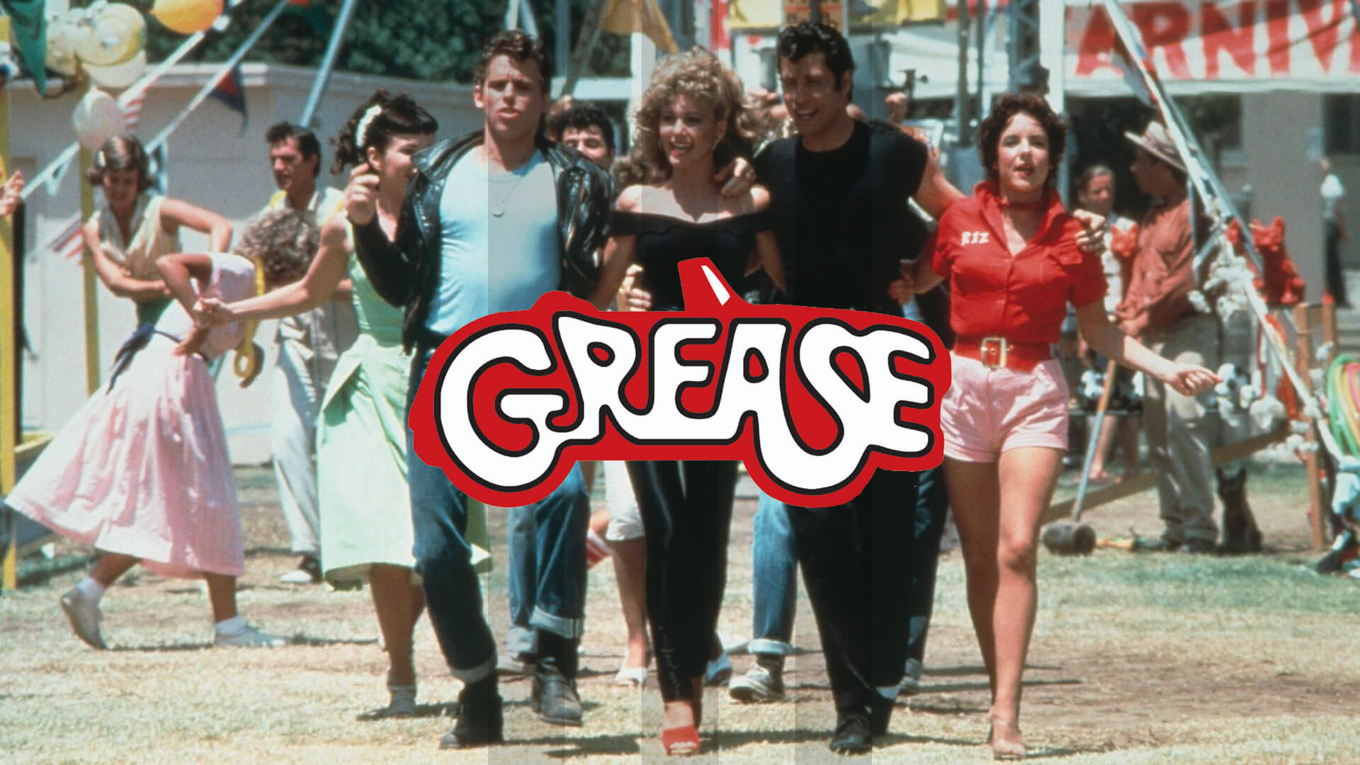 Grease 桌布 壁紙 — 一個充滿活力的1950年代風格團體在陽光明媚的嘉年華上跳舞，並 prominently 顯示了「Grease」標誌。