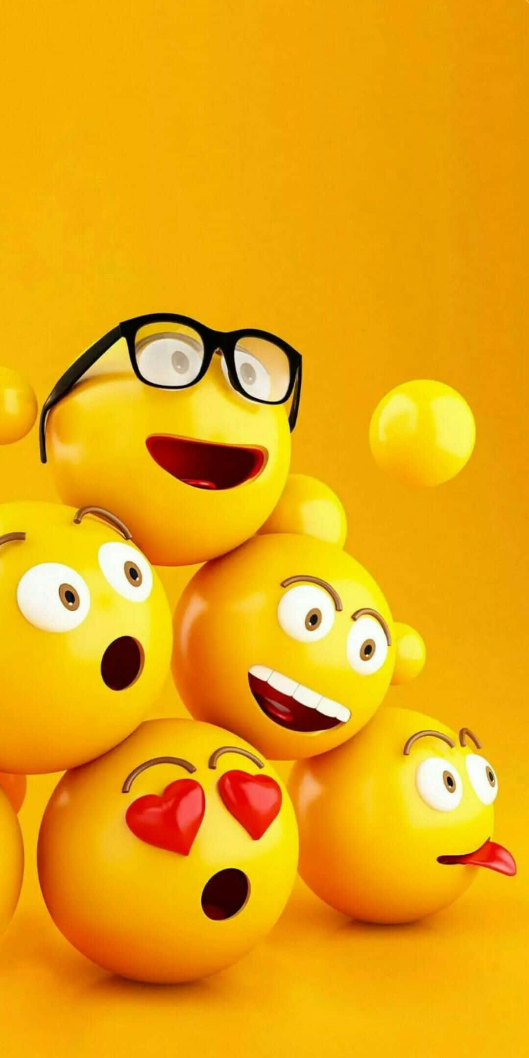 Smile 桌布 壁紙 — 一個充滿活力的3D渲染表情豐富的黃色表情符號臉部群組，戴著眼鏡、愛心和舌頭，背景為純橙色。