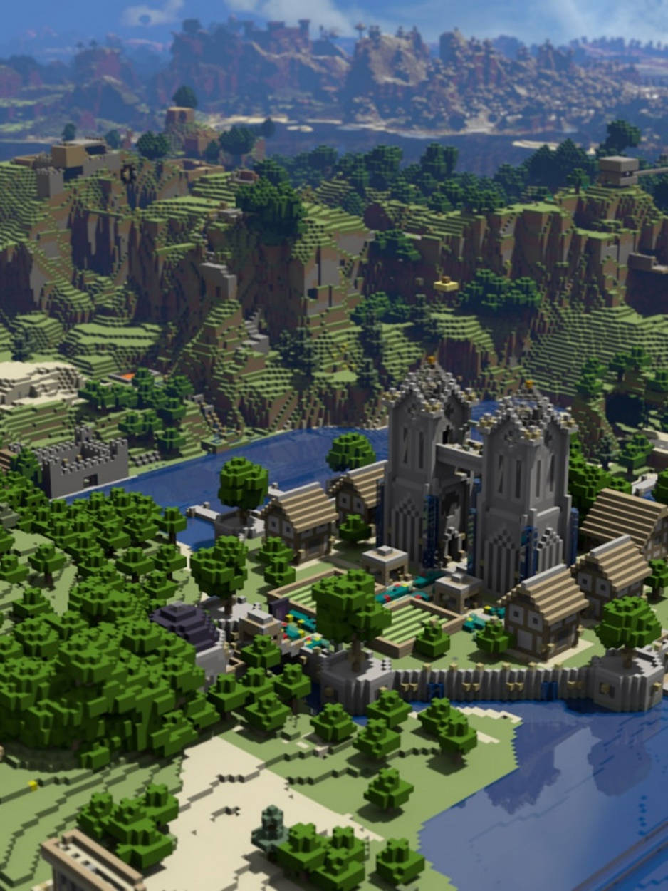 可愛 Minecraft 桌布 壁紙 — 一個充滿活力的Minecraft村莊，坐落在河邊，有城堡和懸崖，在晴朗的藍天下。