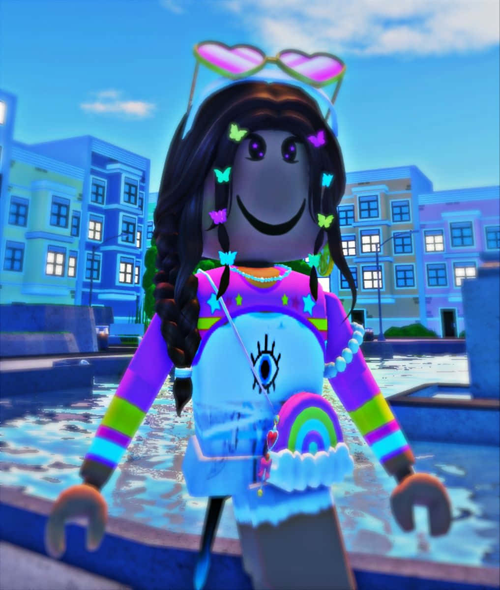 Roblox 桌布 壁紙 — 一個充滿活力的Roblox頭像，帶有發光的蝴蝶髮飾和彩虹條紋袖子，站在色彩繽紛的城市廣場上，天空湛藍。