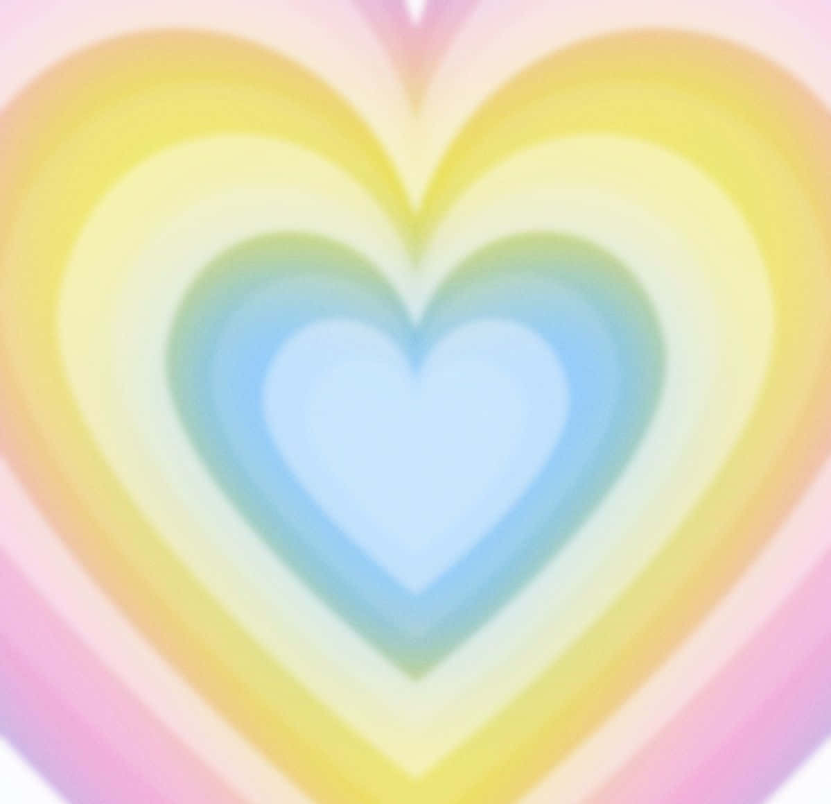 Rainbow Heart 桌布 壁紙 — 一個充滿活力的同心心形圖案，從柔和的粉紅色到黃色和藍色，以舒緩的漸變散發出柔和色調。