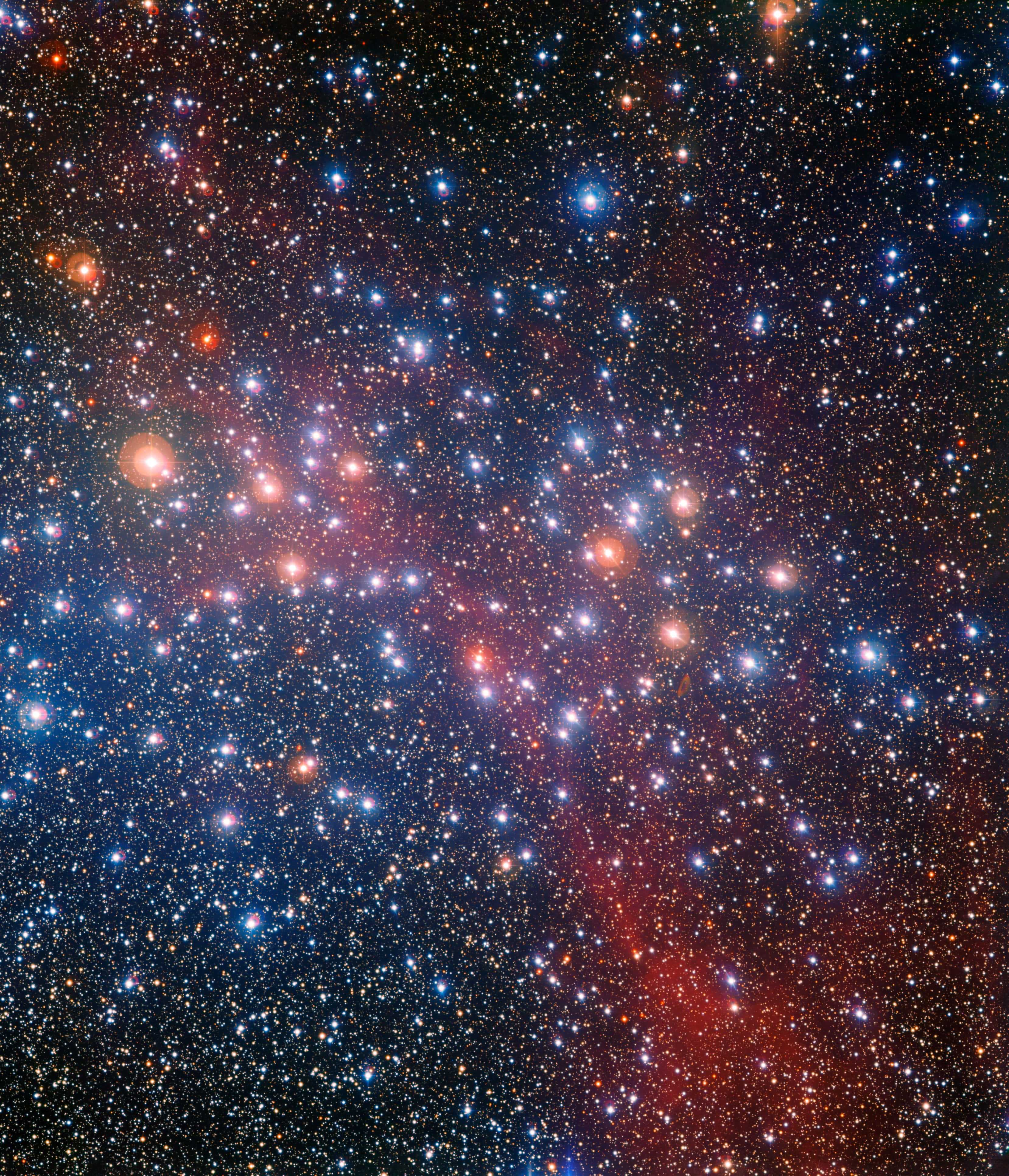 Star Cluster 桌布 壁紙 — 一個充滿活力的宇宙場景，在深邃的黑色虛空中，無數恆星和發光的星雲呈現出火紅和冷藍的色彩。