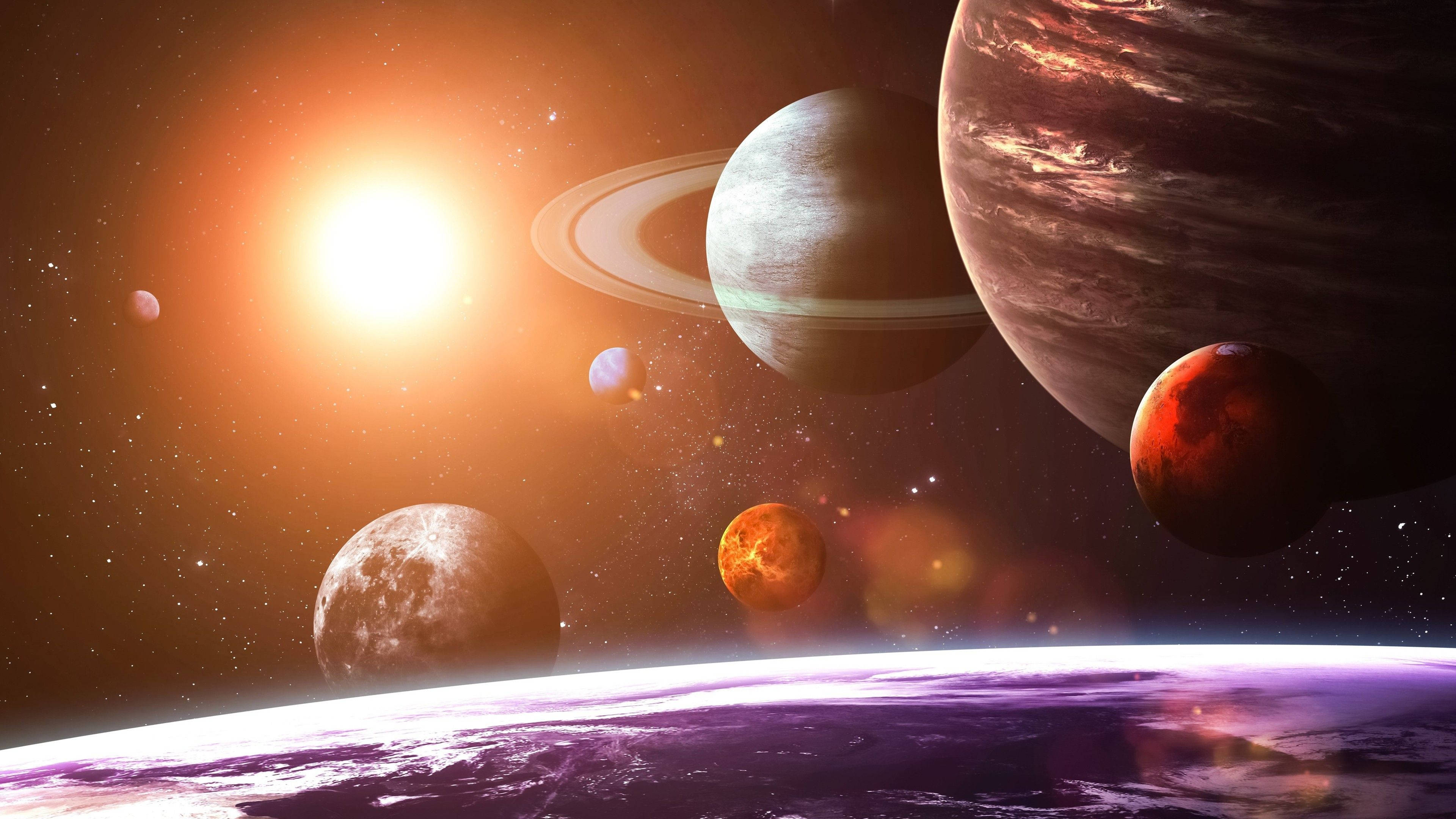 太陽系 桌布 壁紙 — 一個充滿活力的宇宙場景，發光的太陽照亮了包括土星和木星在內的多樣行星，背景是星空。