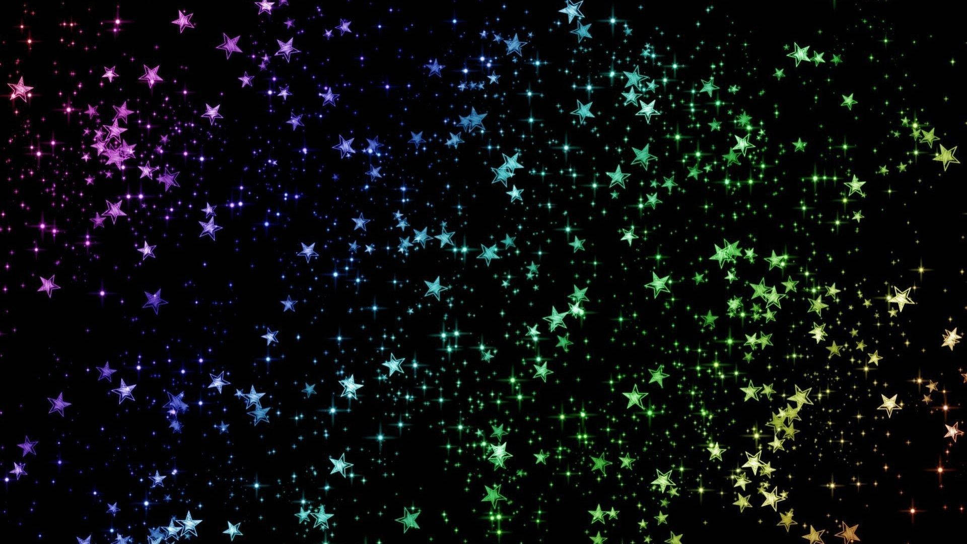 閃爍 桌布 壁紙 — 一個充滿活力的宇宙星場，閃爍著多色光芒的星星在深邃的黑色虛空中傾瀉而下，呈現出令人眼花繚亂的數位顯示效果。