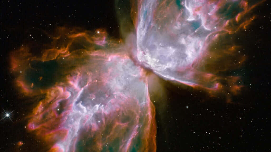 Red Giant 桌布 壁紙 — 一個充滿活力的宇宙星雲，在星空中旋轉著粉紅色、橙色和藍綠色的氣體雲。