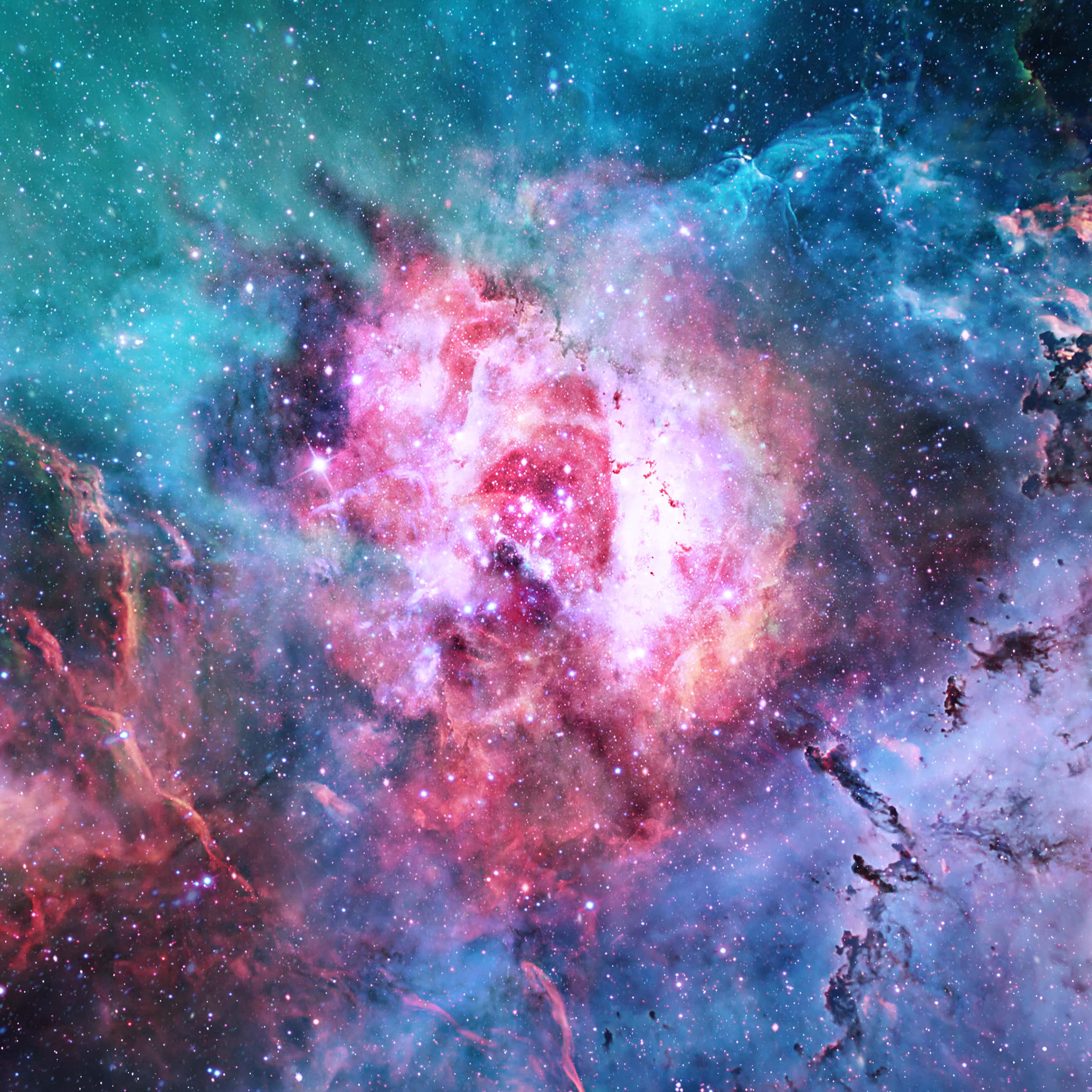 銀河 桌布 壁紙 — 一個充滿活力的宇宙星雲，在星空中旋轉著粉紅色、紅色和藍綠色的雲層。