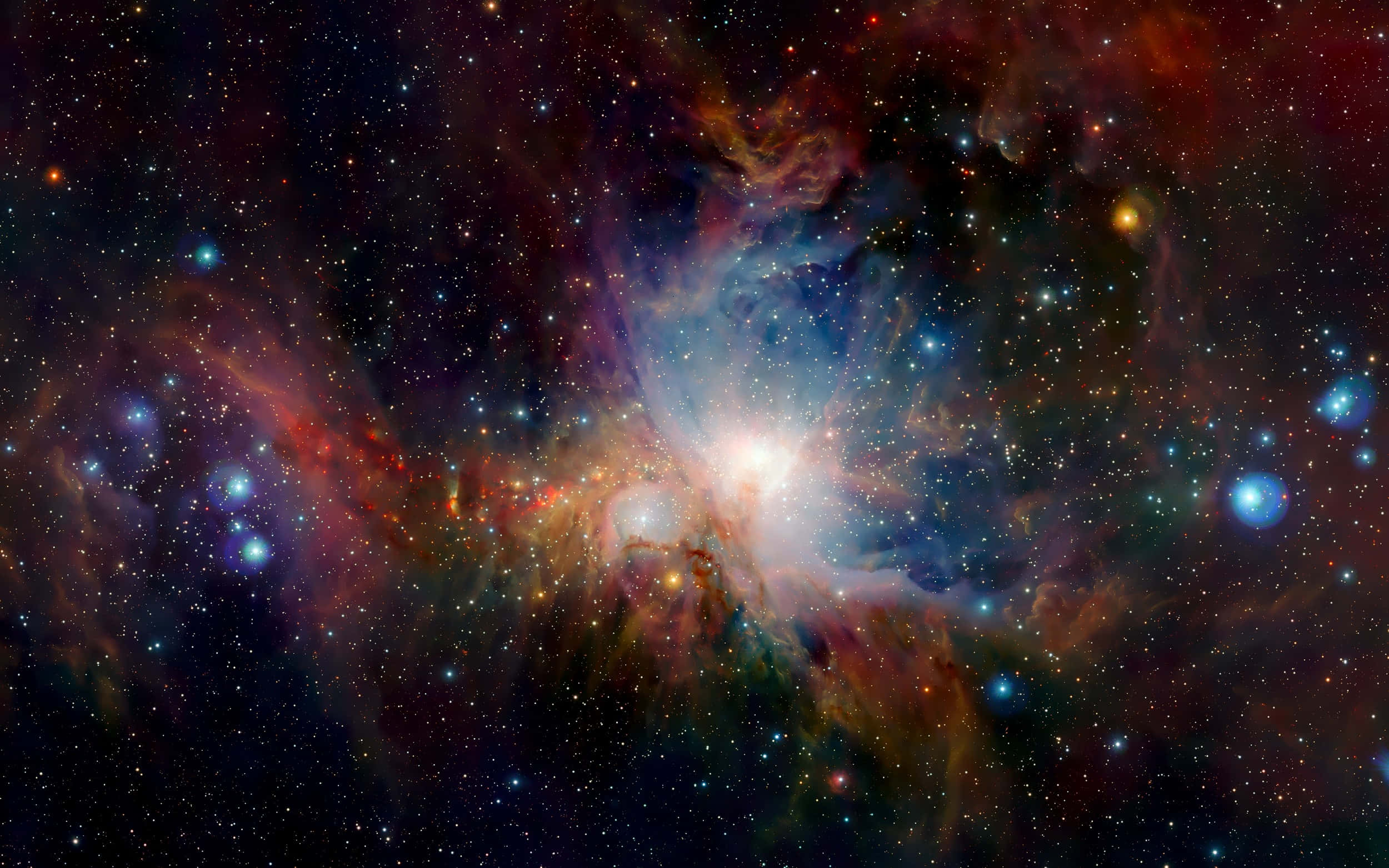 銀河 桌布 壁紙 — 一個充滿活力的宇宙星雲，在星空中散發著旋轉的紅色、藍色和橙色光芒。
